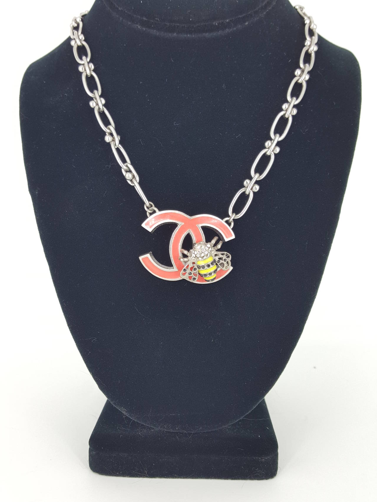 Offered for sale is this lovely Chanel necklace from 2004.  The large coral colored 
