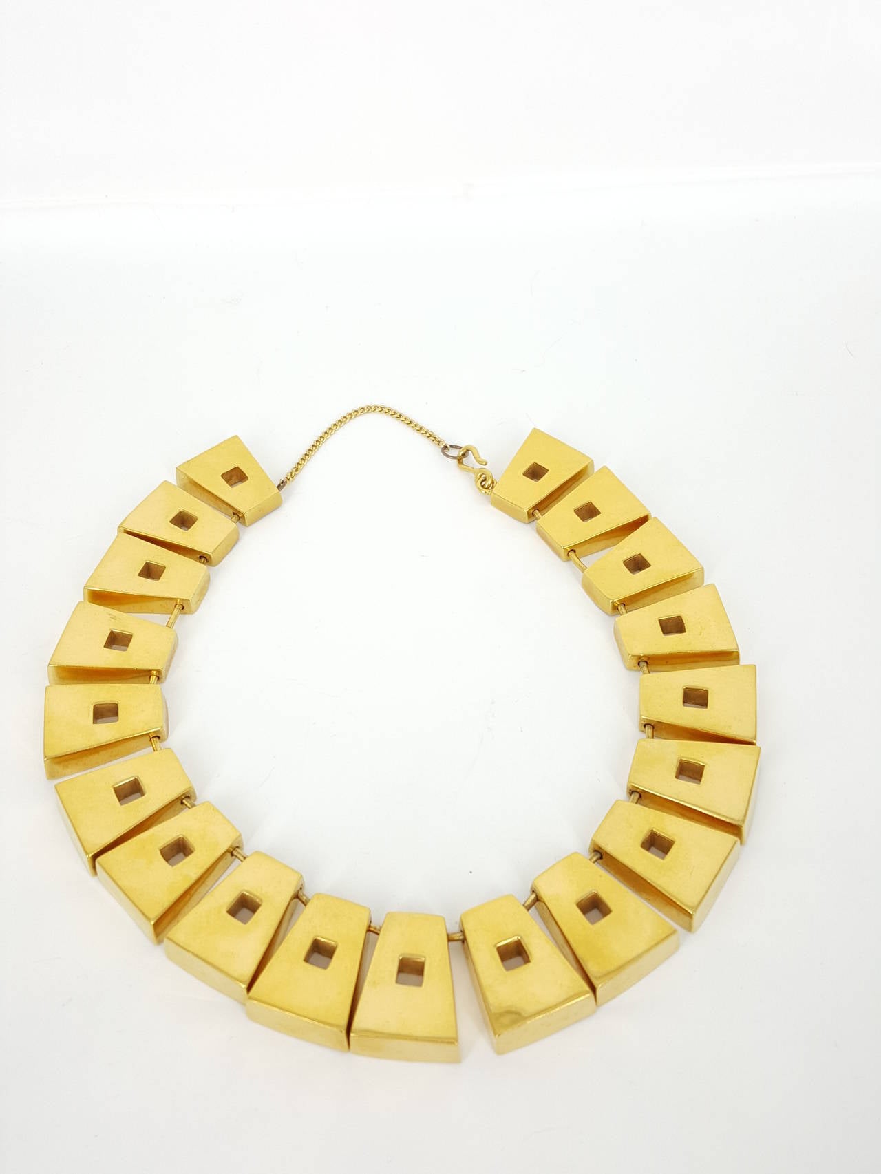 Offered for sale is this early geometric choker necklace signed by Steven Voubel cica 1980's.  This bold design is done is sterling silver Vermeil and is a fabulous look.
Voubel's designs are available still today, but nothing with the flair of