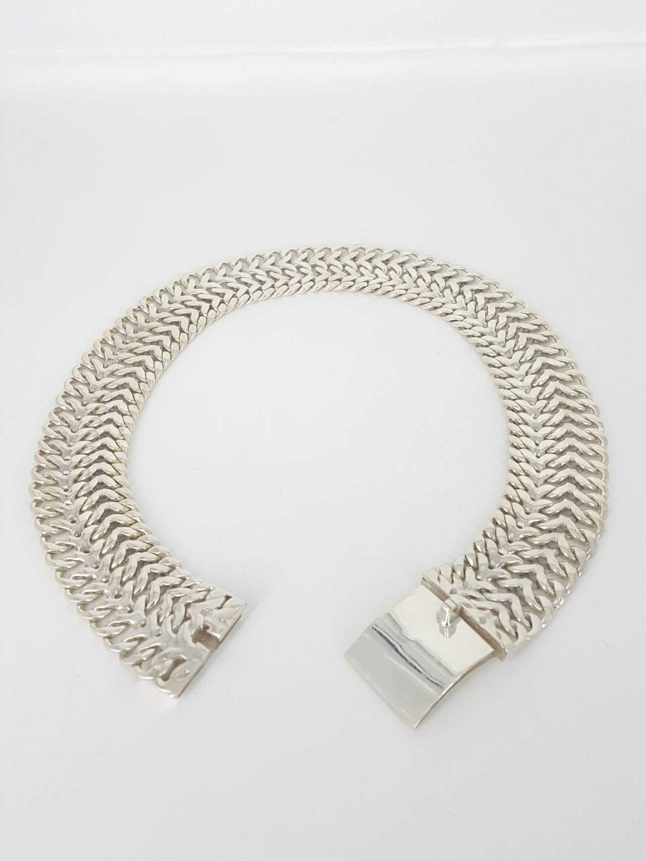 Offered for sale is this beautiful Mexican silver choker necklace by Rodolfo Espinoza from 1980.  This is a wonderful handcrafted piece with a braided look.
It is a stunning 1 1/4