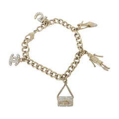 Chanel Iconic Charm Bracelet With 5 Charms In Soft Gold Tone From 2005