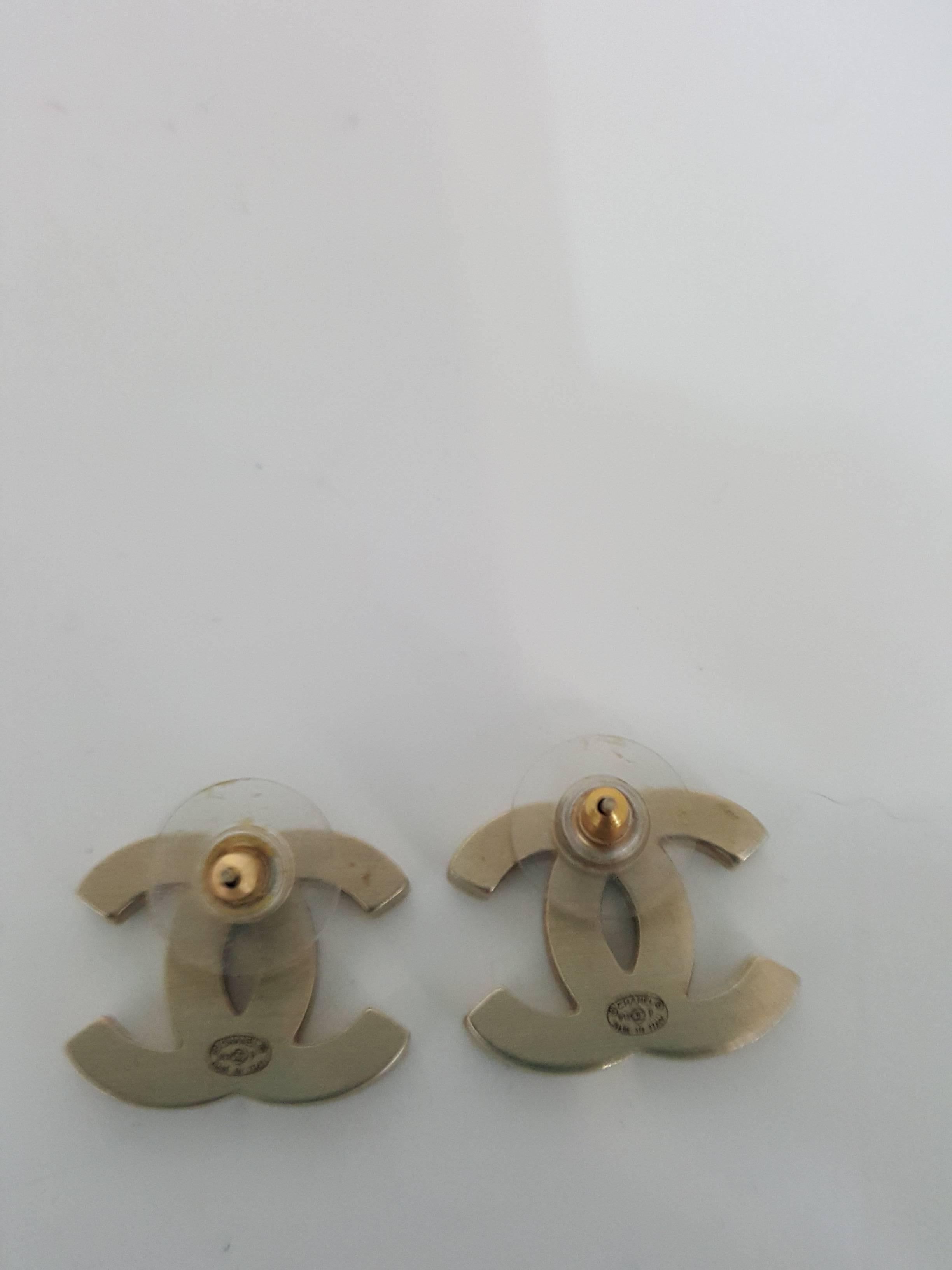 Offered for sale are these iconic Chanel pierced earrings,  They are soft gold metal with black enamel and are pieced.  They are 3/4