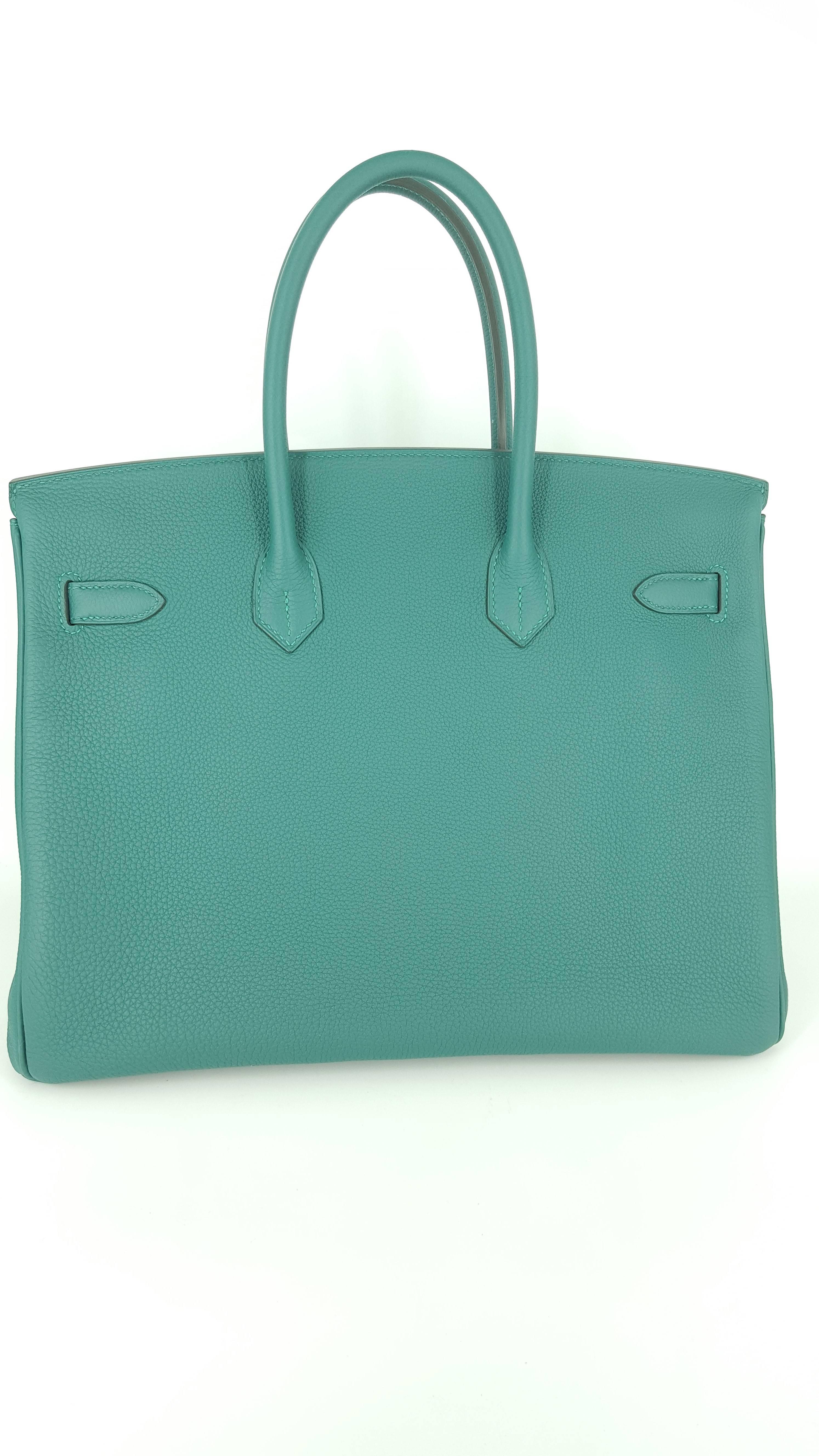Offered for sale is a New Hermes Birkin 35 in the beautiful color Malachite.
This bag was purchased in January 2017 and It still has some plastic on feet.  The Palladium hardware enhances the richness of this limited edition color.  It is complete
