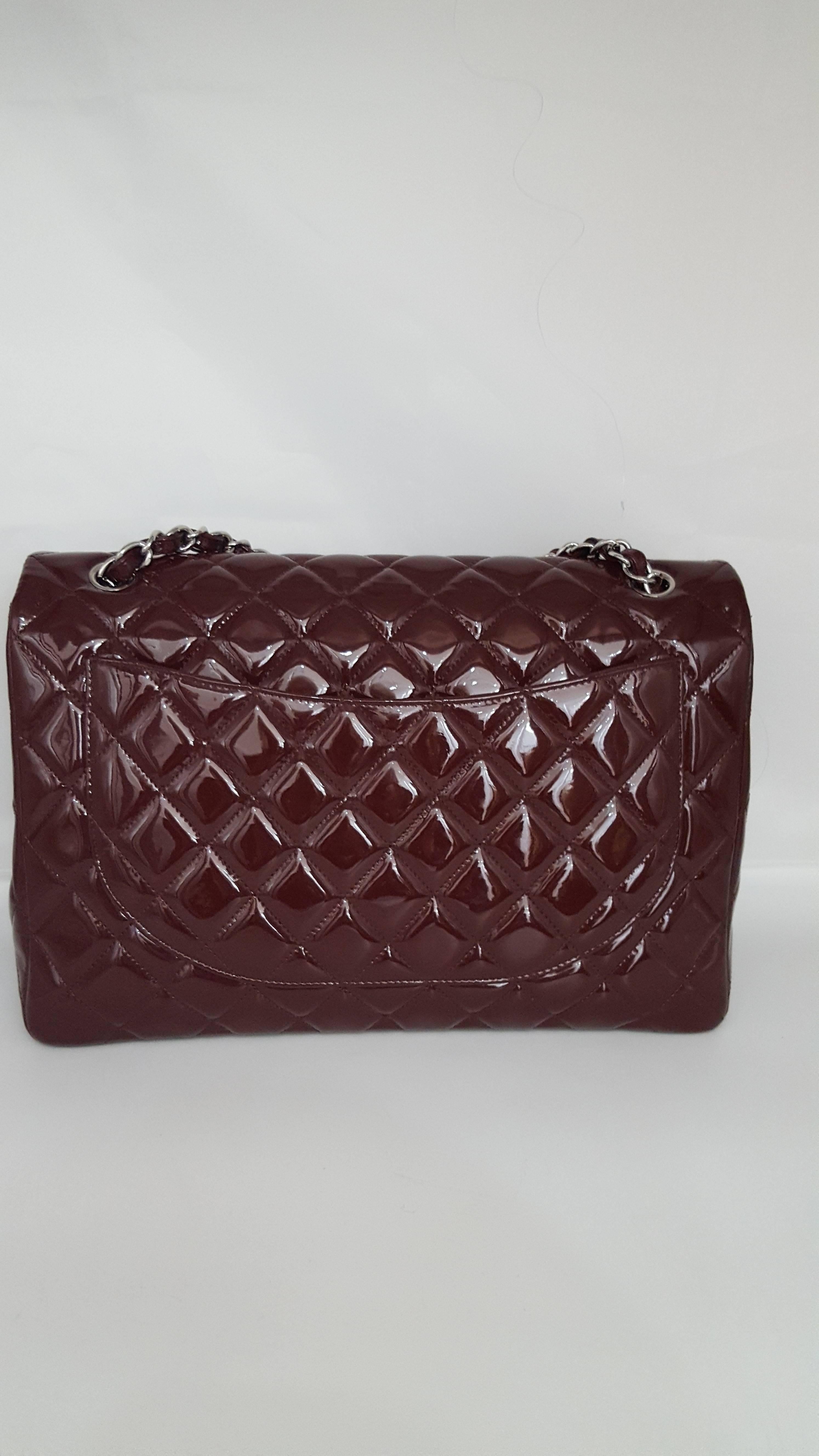 Offered for sale is this gorgeous Bordeaux Chanel XL Jumbo in patent.  This handbag is a single flap and has silver hardware.  It was manufactured in Italy in 2011 and is excellent condition.  The interior is a Bordeaux cloth with one large zipper