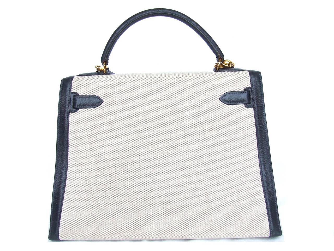 BEAUTIFUL AUTHENTIC HERMES BAG

KELLY

Sellier Version

Made in France, stamp X in a circle

Made of:

- beige canvas (toile)

- Navy Blue Epsom Leather

- Gold Hardware

Fully lined with navy blue leather, except the pockets which