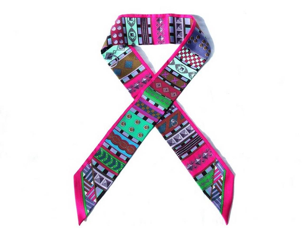 BEAUTIFUL AUTHENTIC HERMES SCARF

 
TWILLY

 
Pattern: Colliers de chiens

 
Made in France, design by Virginie JAMIN

 
Made of 100% Silk

 
Colors: Fuschia (pink), Green, Blue

 
Measurements: 85 x 5 cm (33,4 x 2 inches)

