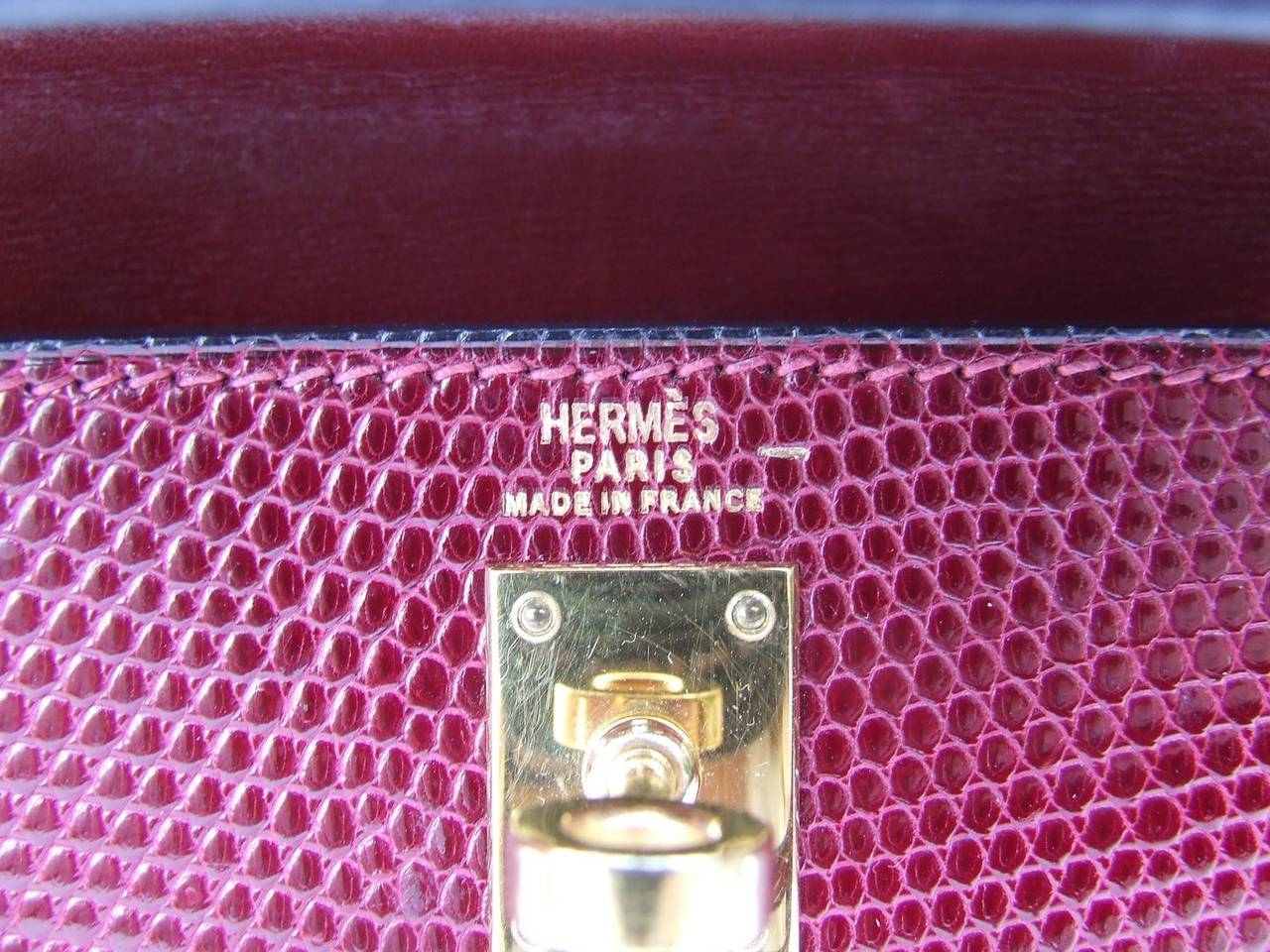 GORGEOUS and RARE AUTHENTIC HERMES BAG

MINI KELLY

So rare to find a baby Kelly with both handle and shoulder strap, especially in Lizard skin and Rouge Hermès colorway, and in such great condition

Made in France in 90's

Made of Lizard