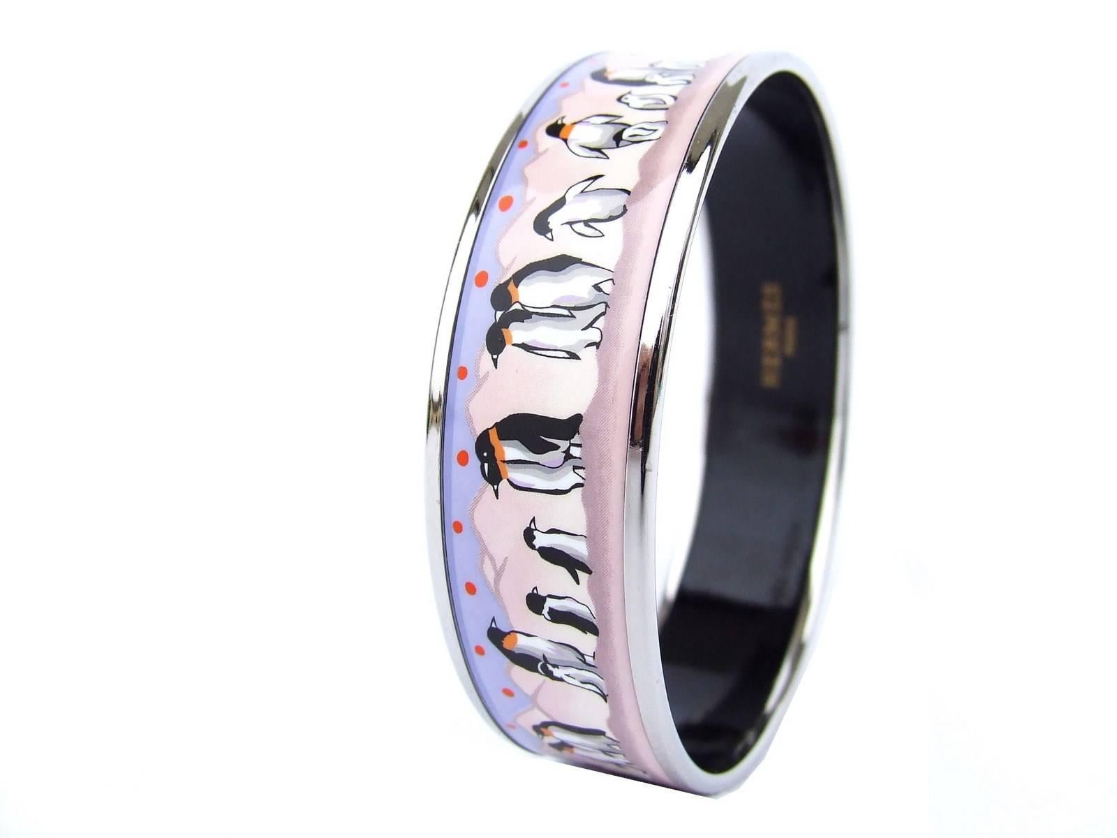 BEAUTIFUL AUTHENTIC HERMES BRACELET

 

Patter: Penguins on ice

 

Very Rare and gorgeous bracelet

 

Made in Austria, stamp E

 

Made of Enamel, Silver and Palladium plated hardware

 

Colors: Pink backgground, Pulrple Sky,