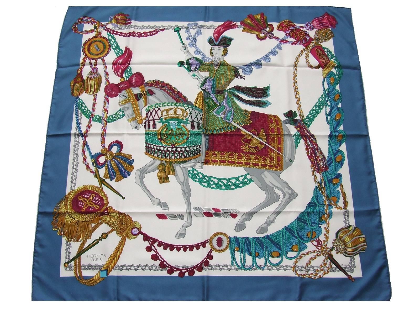 Stunning Authentic Hermes Scarf

Pattern: Le Timbalier

Made in France

Designed by Fracoise Heron in 1961

Made of 100% Silk

Colorways: Blue border, White Background, Multicolour Drawings

The colors are vibrant, beautiful . This is a