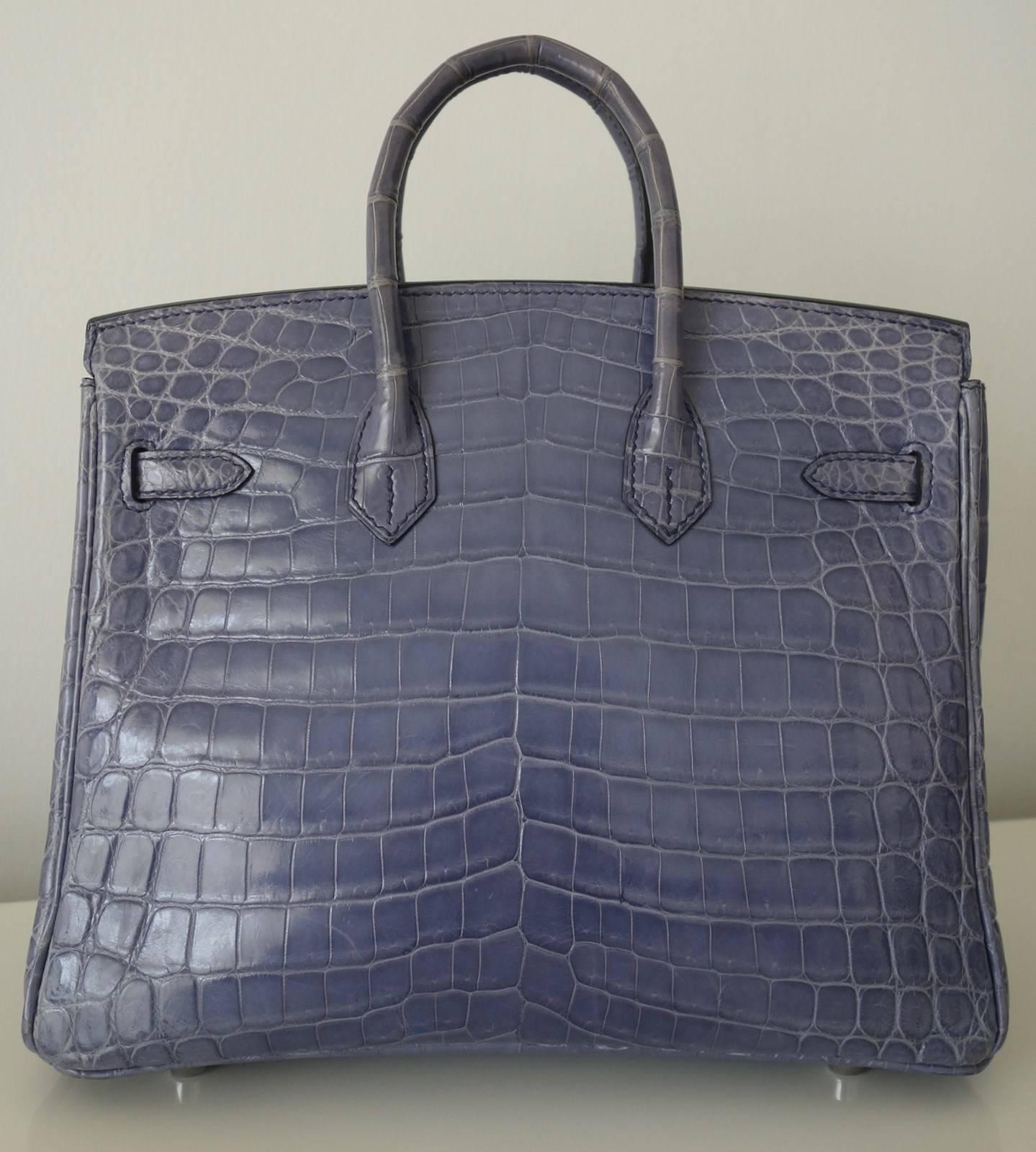 Gorgeous Authentic Hermes Handbag

"BIRKIN"

Made in France

Stamp K in a square

Made of Crocdile Niloticus skin and Palladium Hardware

Colorway: Bleu Brighton. Not made anymore !

Lined wih matching leather

1 main compartment, 1