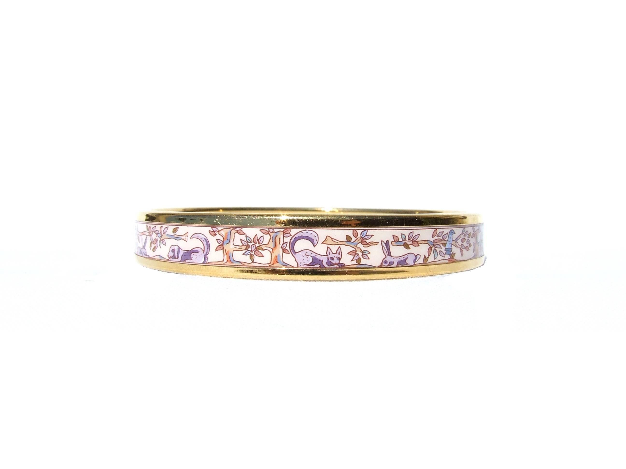 Beautiful Authentic Hermes Bracelet

Pattern: Cats, Dogs, Rabbits, Birds, Trees drawing an H

Made in Austria + F

Made of Enamel and Gold plated Hardware

Colorways: To me background is pink, any will see it beige I think. Drawings in purple, blue,