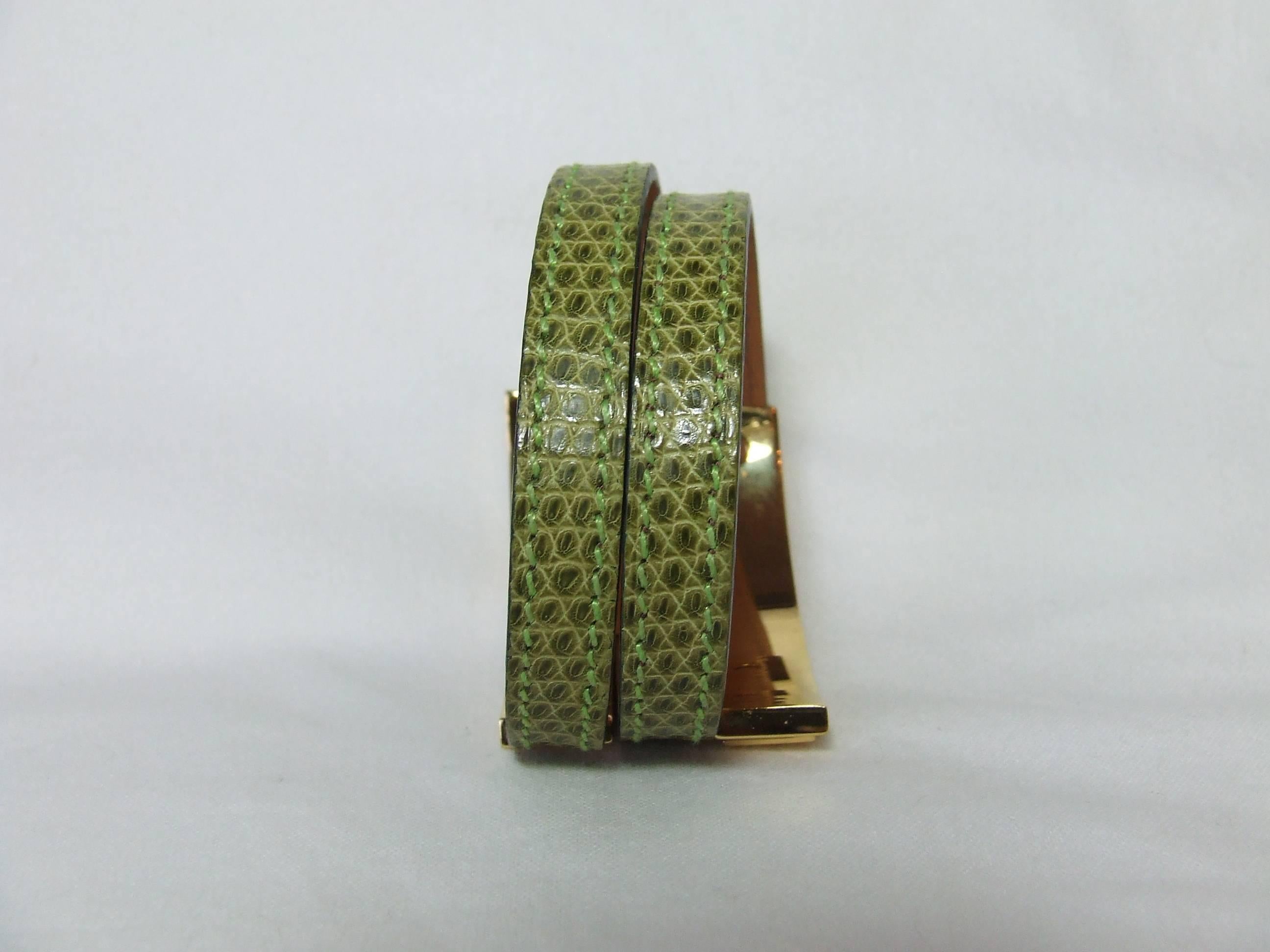 Beautiful Authentic Hermes Bracelet

"Pousse Pousse"

Stamp G in square

Made of Lizard Skin and Golden Plated Hardware

Colorway: ight Green

Size: Will fit any wrist as the bracelet adjusts by sliding the leather in the bars of the