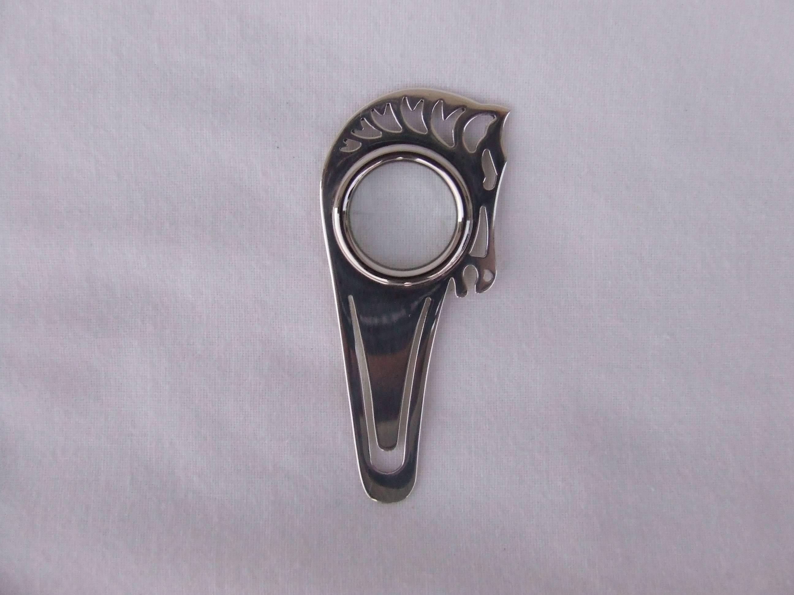 Authentic Hermes 3 functions item:

- paperclip
- magnifying glass
- bookmark

Shaped as horse head

Made of Silvered metal

