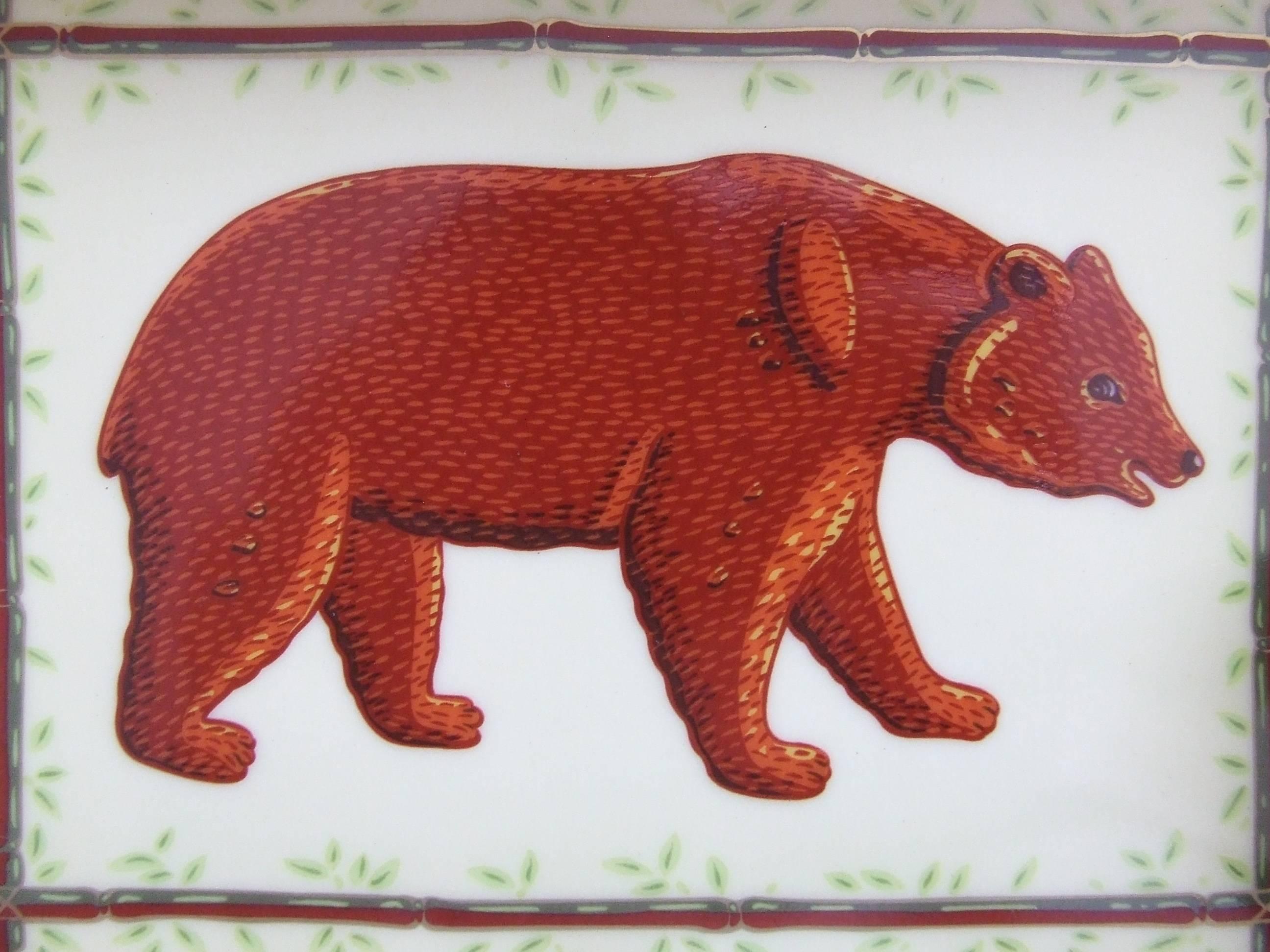 Gorgeous Authentic Hermès Ashtray

Pattern: Bear in a bamboo decor

Made in France

Made of Printed Porcelain

Bottom is covered with beige suede

Colorways: Pale Yellow Background, Brown Bear, Green and Brown bamboo, Golden Border. 

