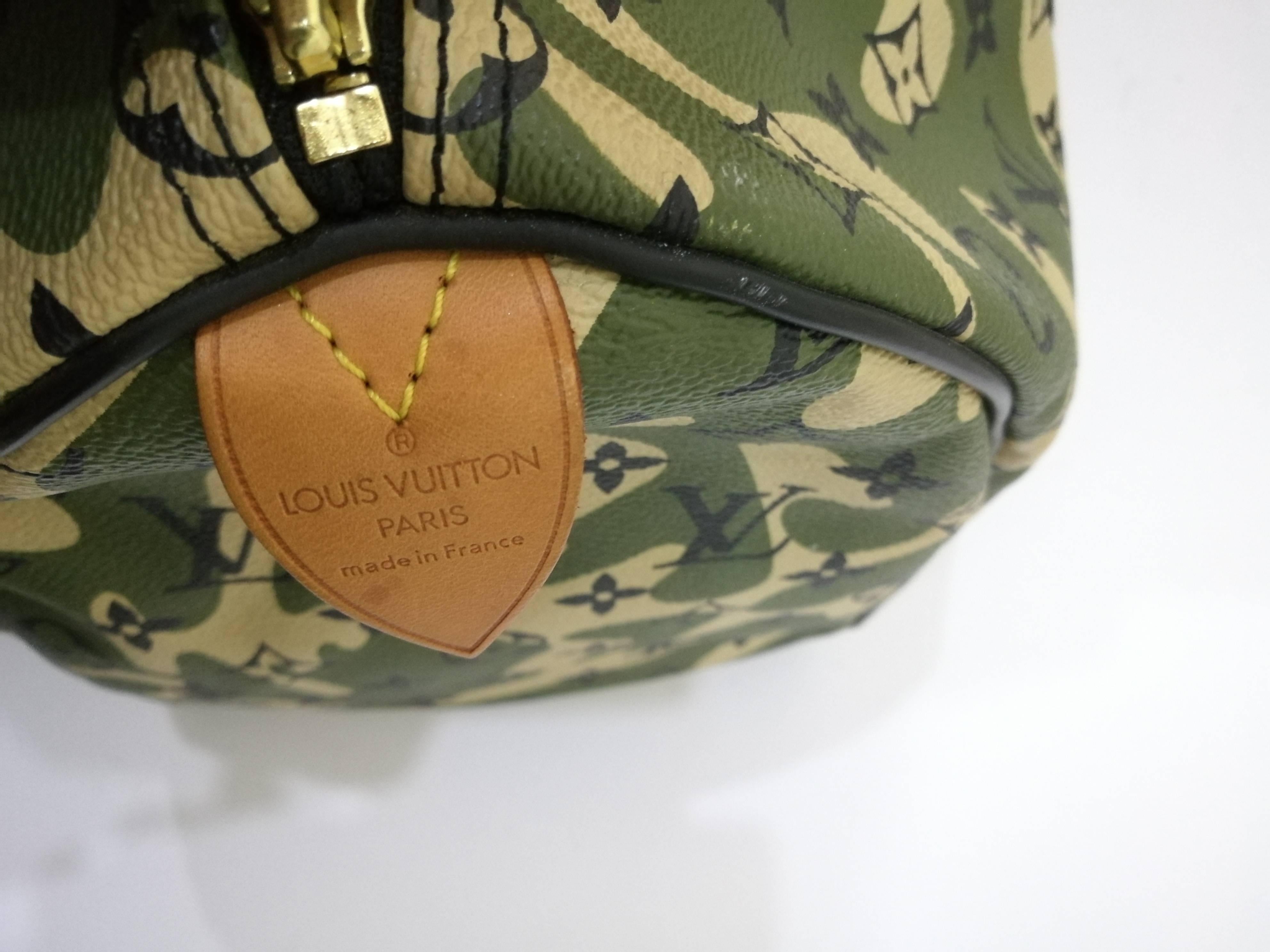 LOUIS VUITTON Monogramouflage Speedy 35 

This stylish tote is crafted of black monogram on green and ivory camouflage coated canvas. It features vachetta rolled leather top handles, black canvas trim, black leather piping and brass hardware. The