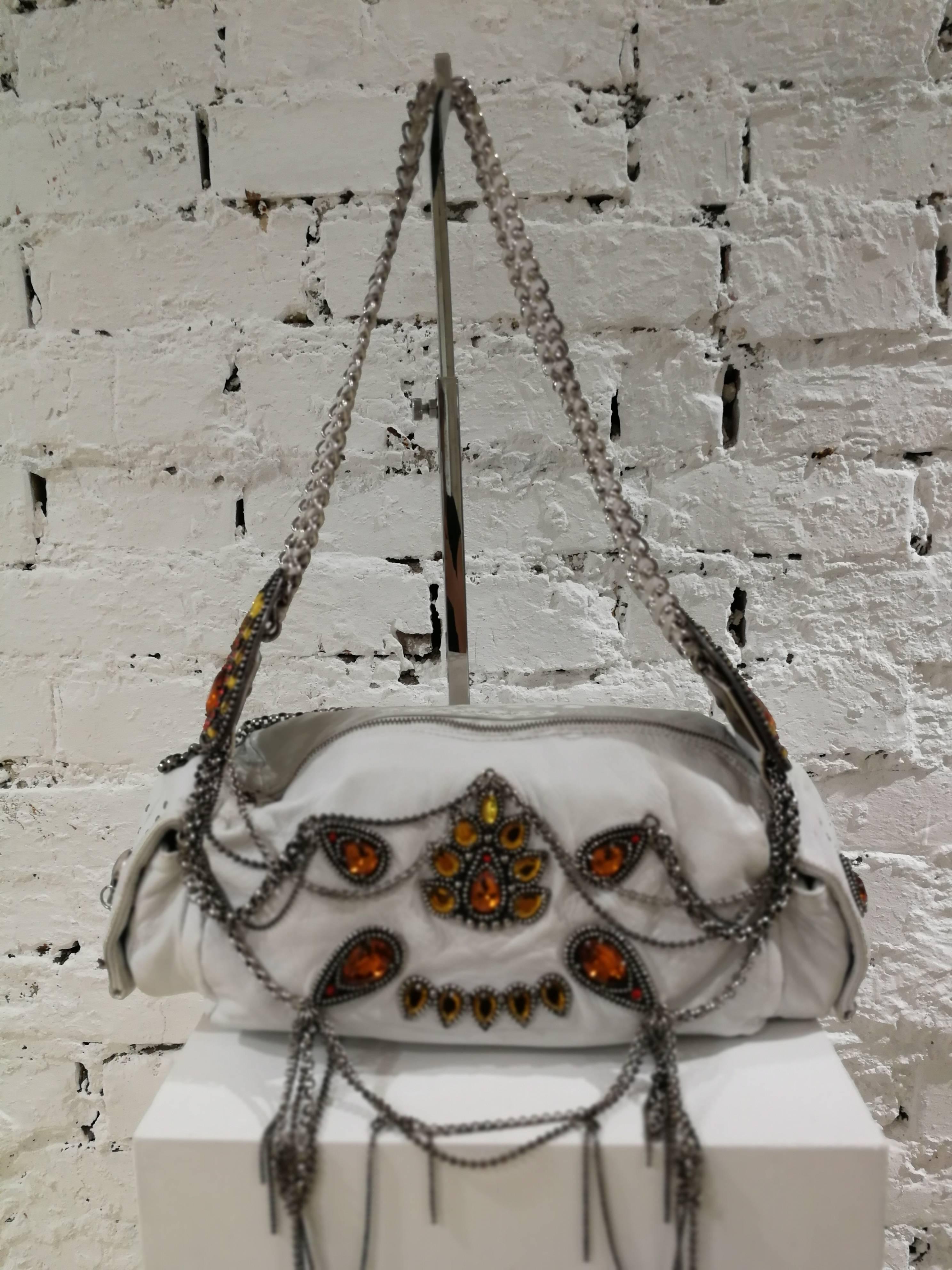 John Richmond white leather chains and swarovsky Shoulder Bag

Richmond white leather bag with silver tone hardware all over on both sides silver tone skulls

Silver tone chain are allover embellished with orange real swarovsky

Totally made in