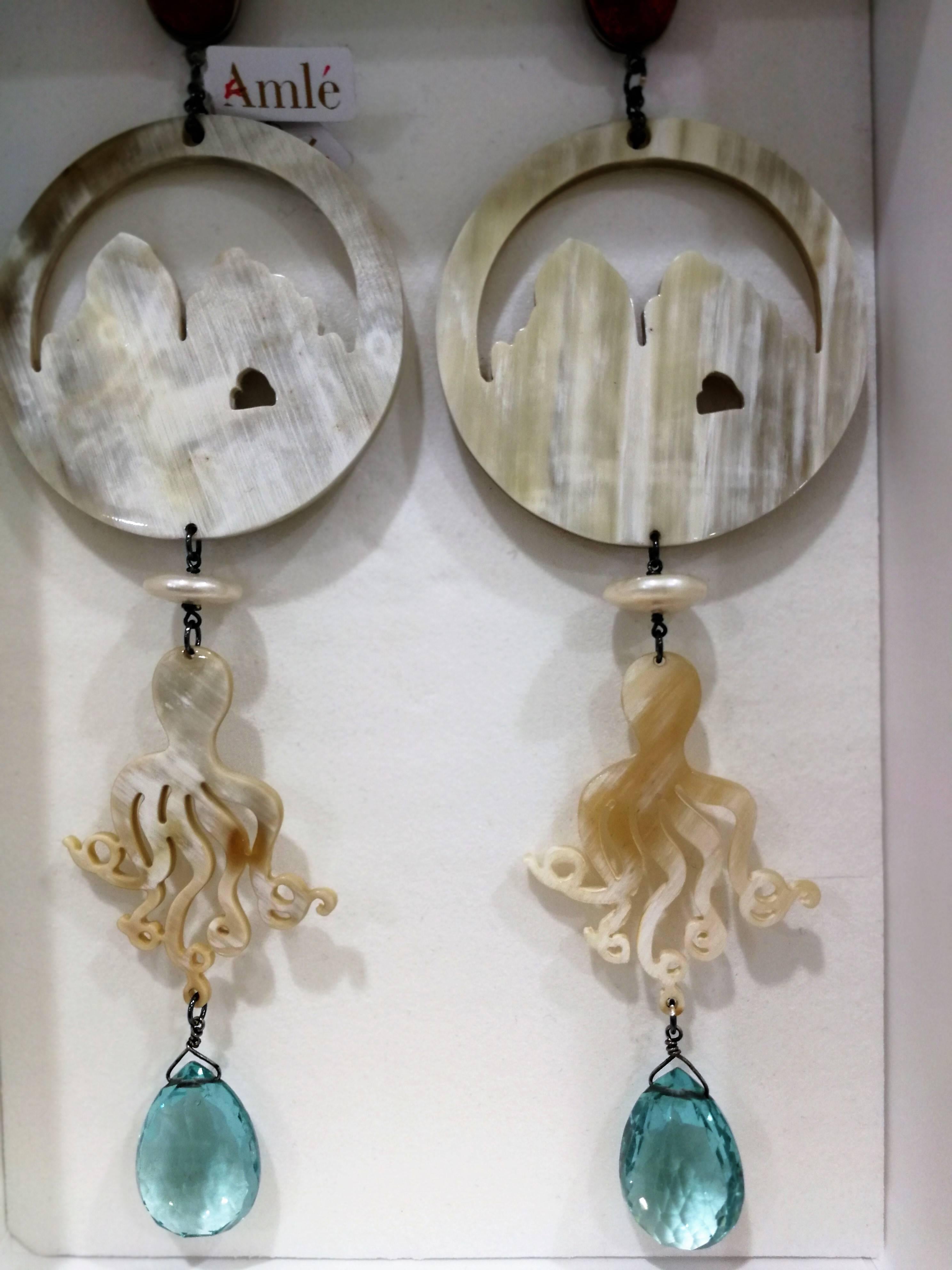 Amlè Horn Aquamarine Handmade Faraglioni Capri Earrings

totally handmade in a limited edition just for our store Earrings
Embellished with corals and aquamarine
Total lenght: 20 cm