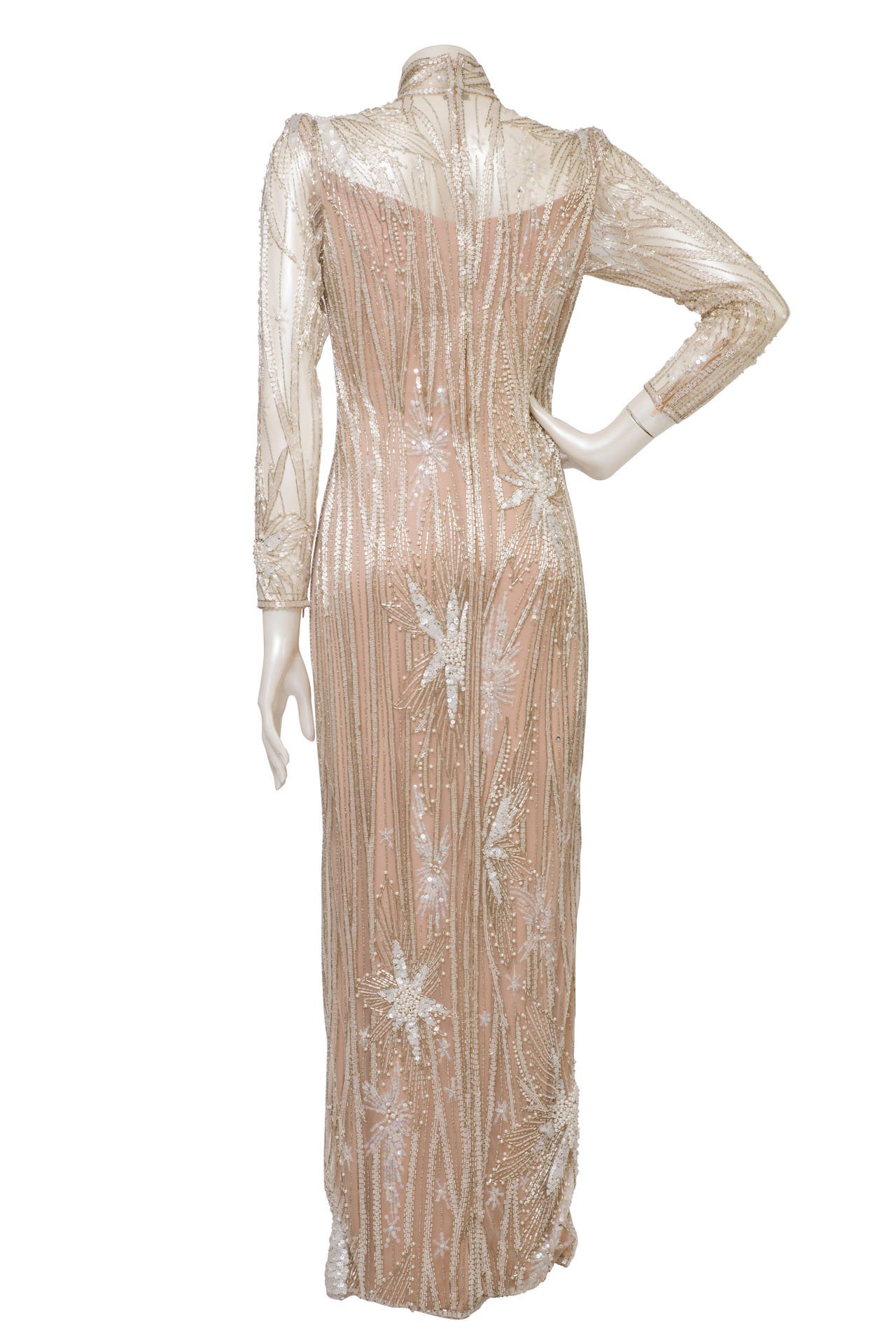 1980s Bob Mackie nude and silver beaded and pearl Gown / Dress
Unique Bob Mackie Gown totally made of nude and silver beaded. This kind of very early net Mackie dresses were, and still are, priced really high as they  really are work of art. 
Size
