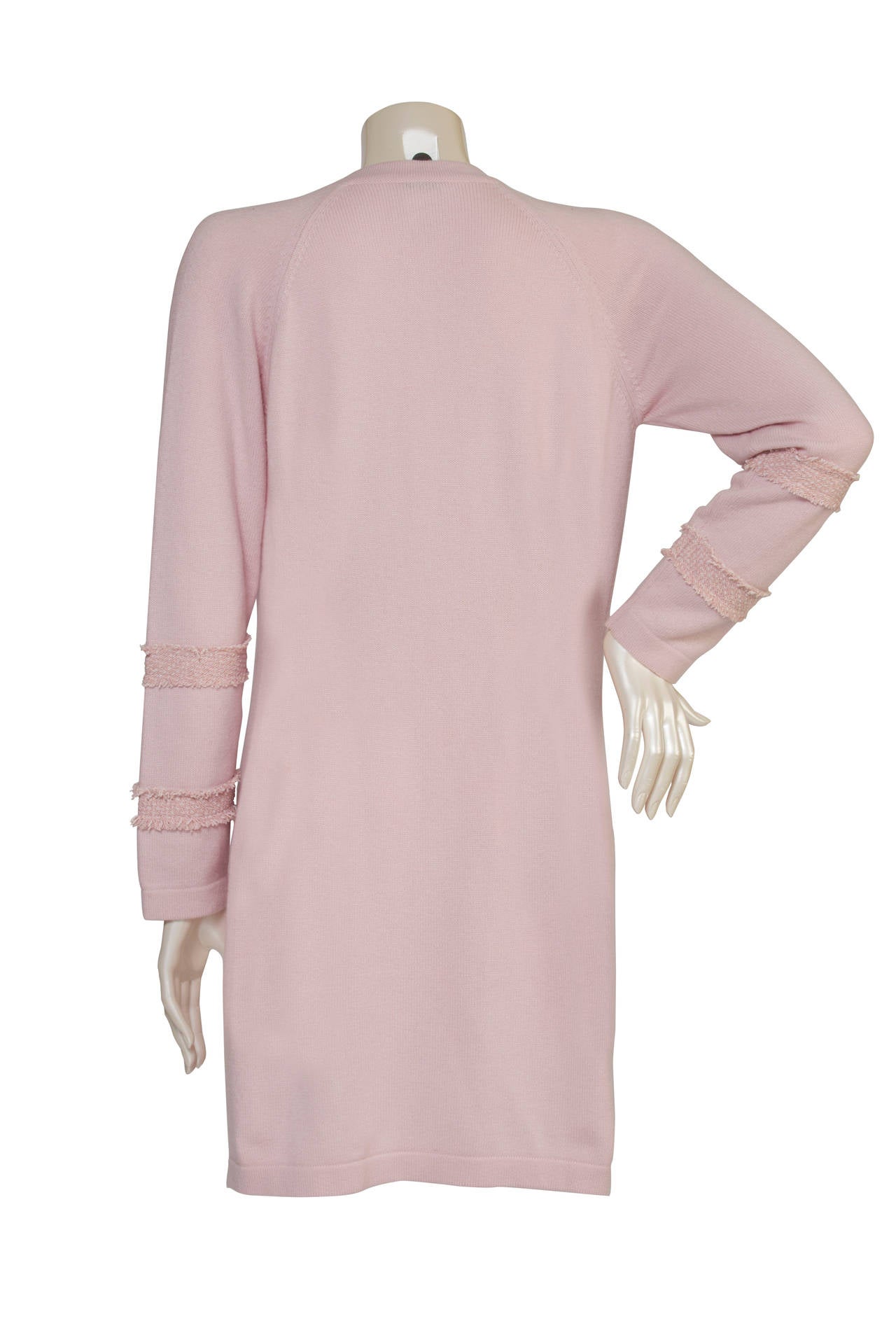 Chanel Boutique Vintage Pink Cardigan with 4 tasks and 3 bottons on the front