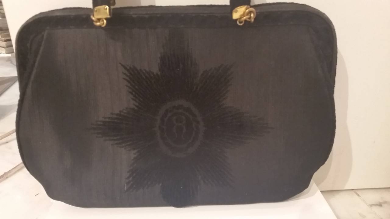 1960s Roberta di Camerino  black bag in textile and velvet. 
Lining Red leather