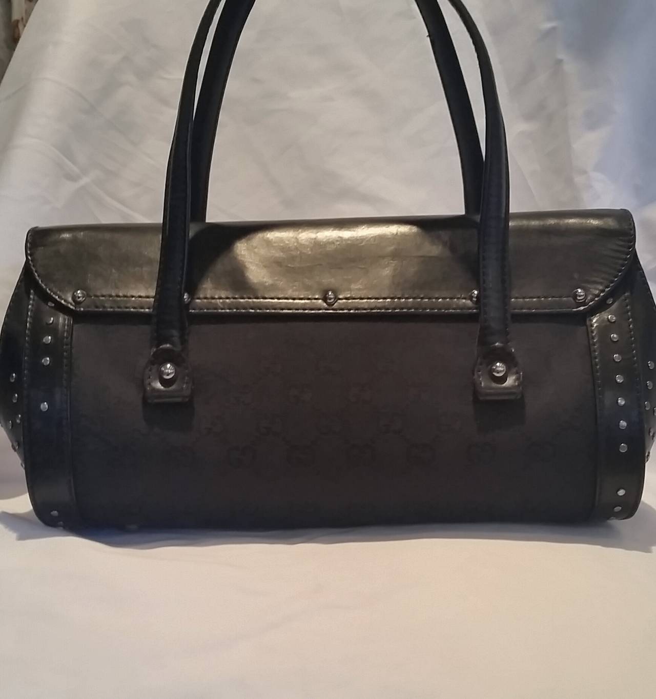 Black 2000s Gucci black leather bullet with bamboo and studs