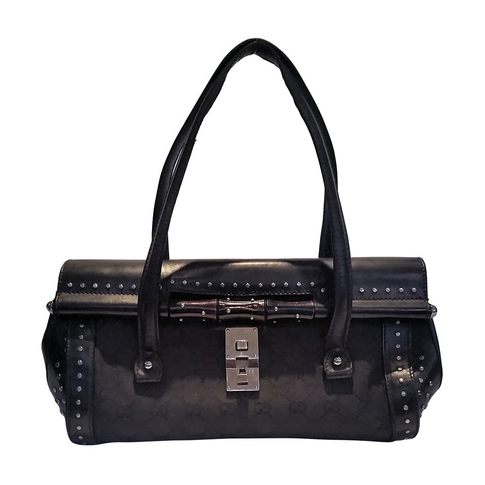 2000s Gucci black leather bullet with bamboo and studs at 1stDibs