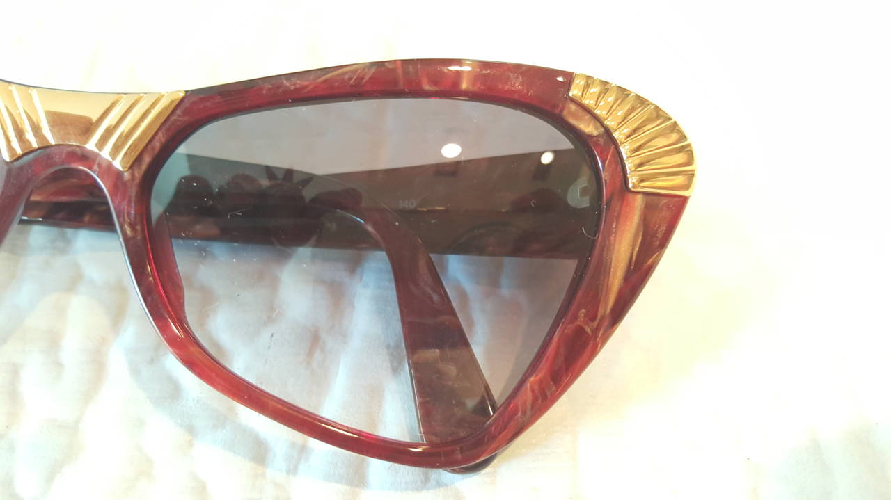 1980s Yves Saint Laurent tortoise with gold colour on the main front and borders sunglasses.