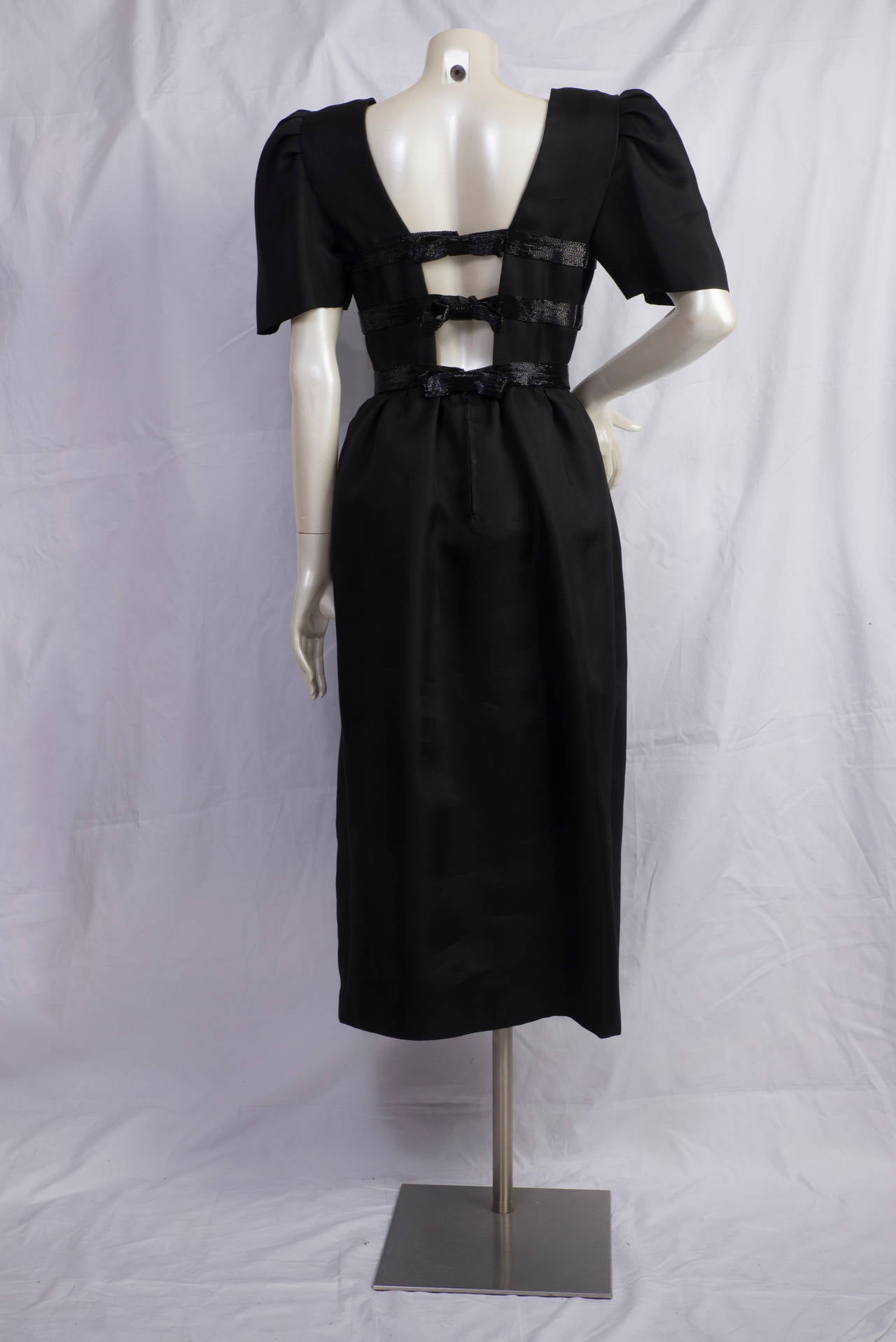1980s Renato Balestra amazing black dress with 3 gorgeus bowes on the back
Never used
still with tags