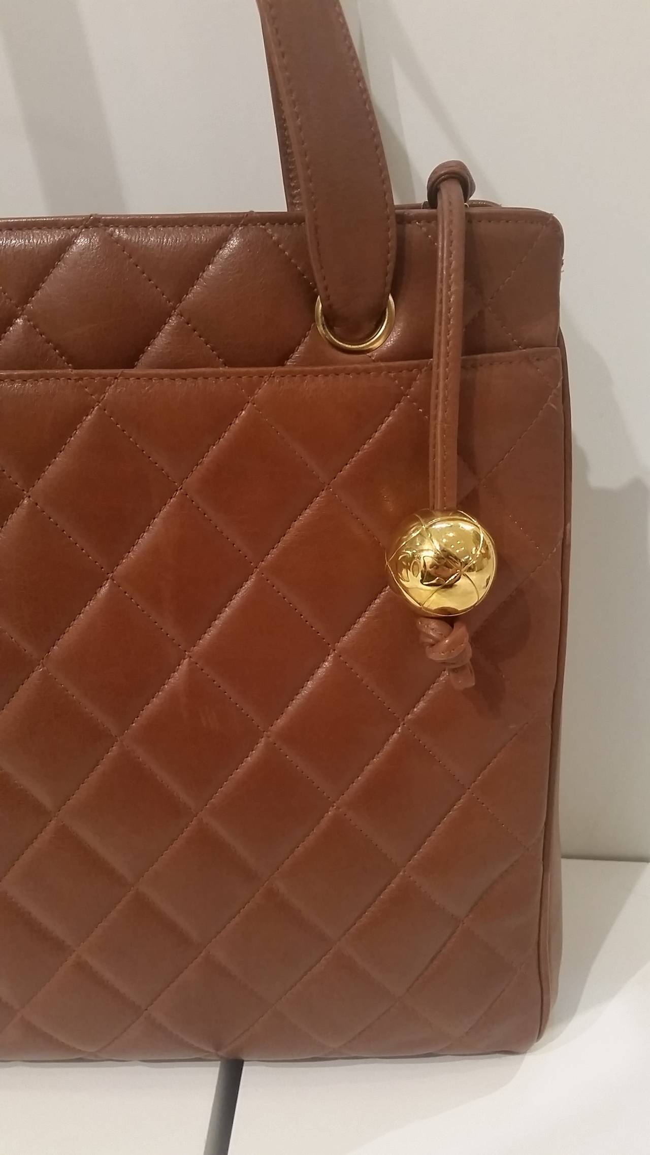 1991- 1994 s Chanel brown leather bag
Very rare and hard to find Chanel vintage bag with gold double CC ball on the zip! Lamb skin in really good condition