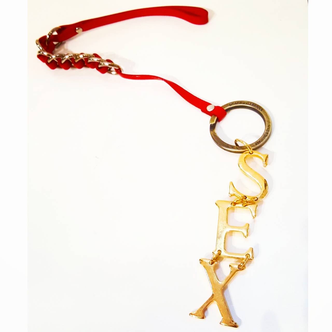 2000s Dolce & Gabbana Key ring gold tone 
red strap