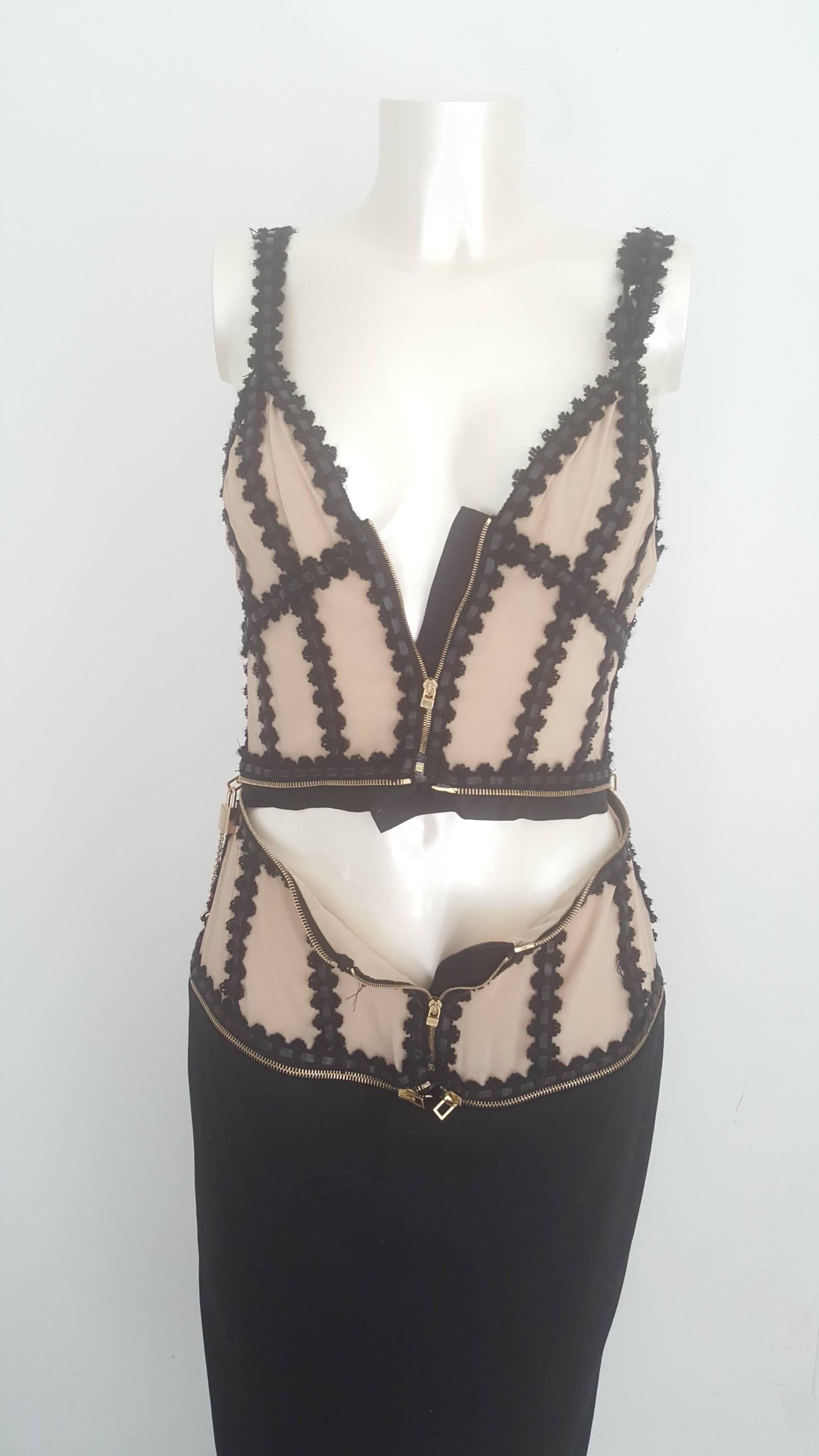 Beautiful haute couture dress by Alexander McQueen, new with original tags. Made with functional zips, leather and silk applications on wool. Nude look corset on black longuette skirt.  Retail price more that 2k€ size 44