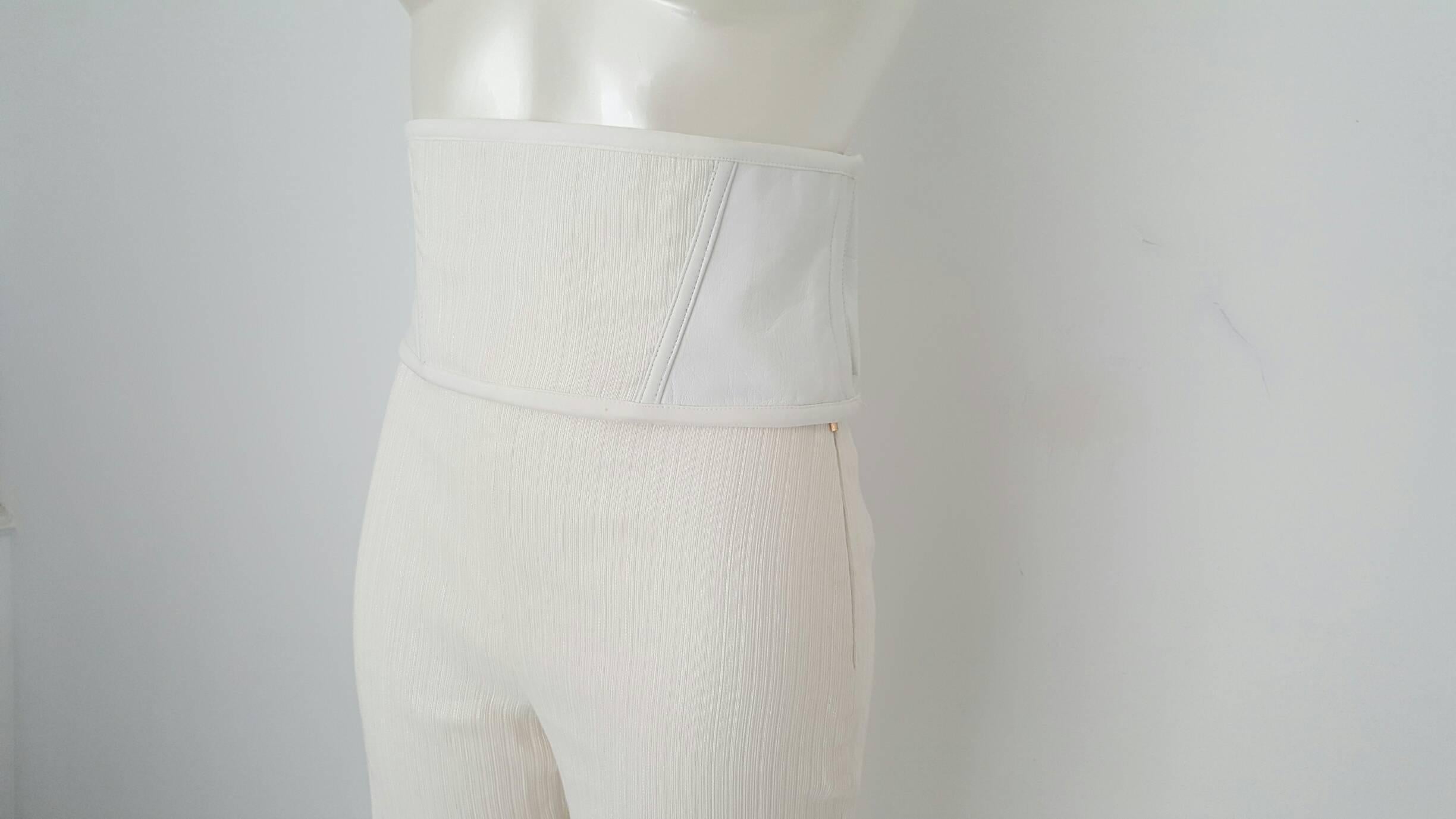 1990s Gianni Versace white trousers with belt still with original tags 
in italian size range 40
composition is 76 viscose 24 silk
