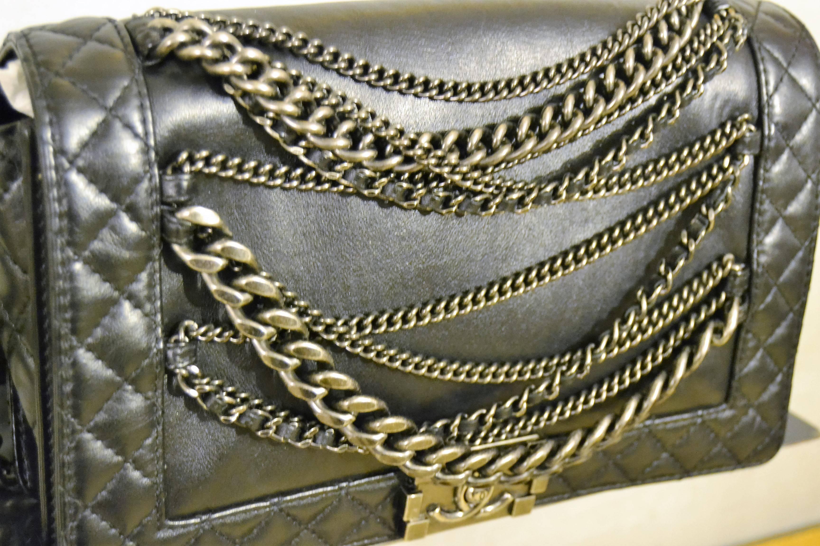 2000s Chanel Boy multi chain lambskin bag

This 2013 Cruise Collection Chanel Boy in Black with Multi Chains detail is a clever creation by Chanel.
It features gorgeous calfskin leather and Quilted trim and antiqued silvertone chain straps.
You
