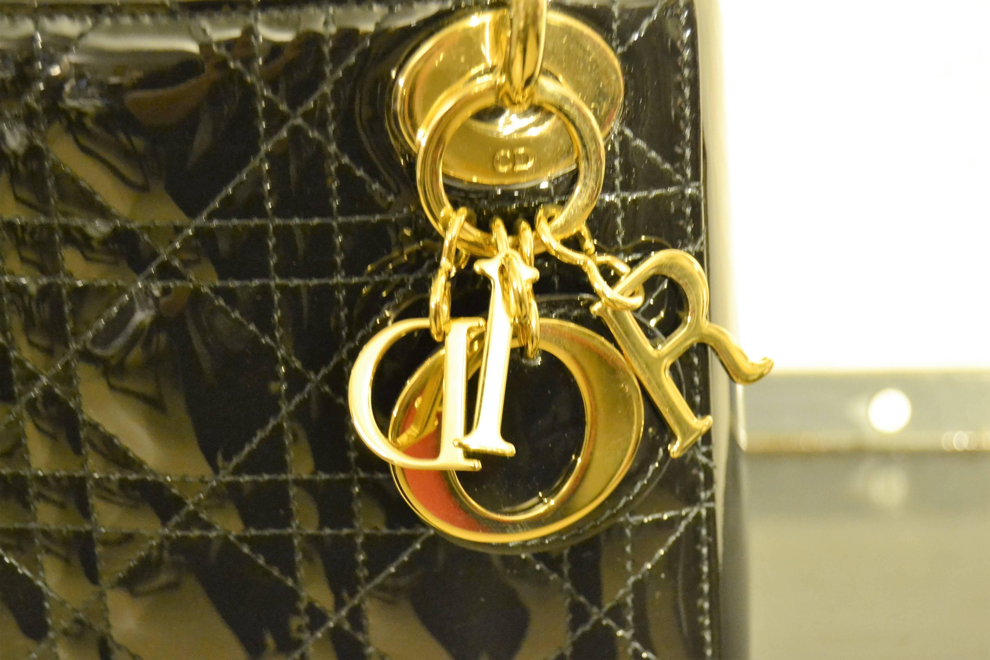 2000s Christian Dior black vernish mini dior bag with gold hardware