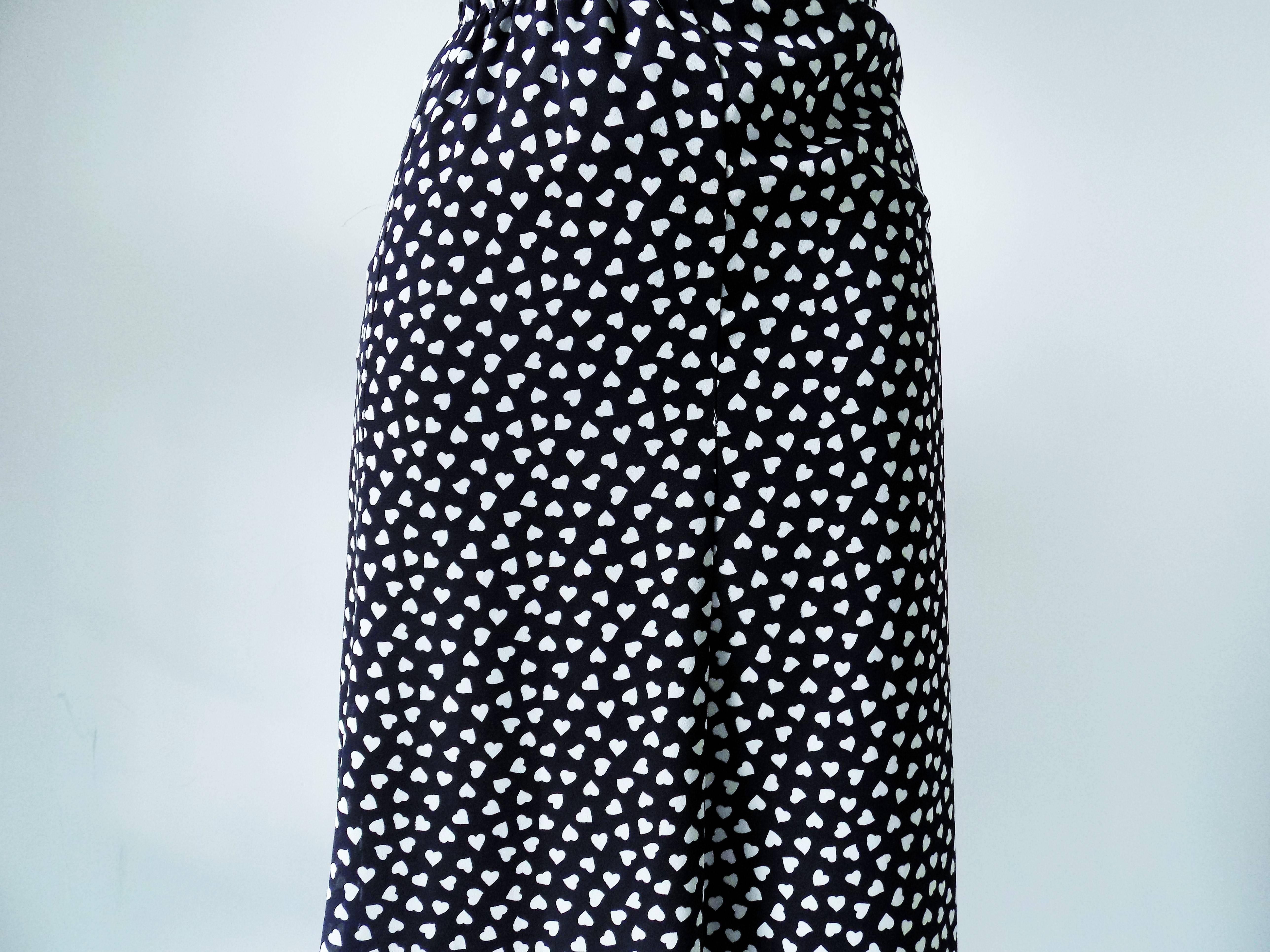 1970s Pierre Cardin Long black skirt with white hearts

Made in france

Size: 48 size range