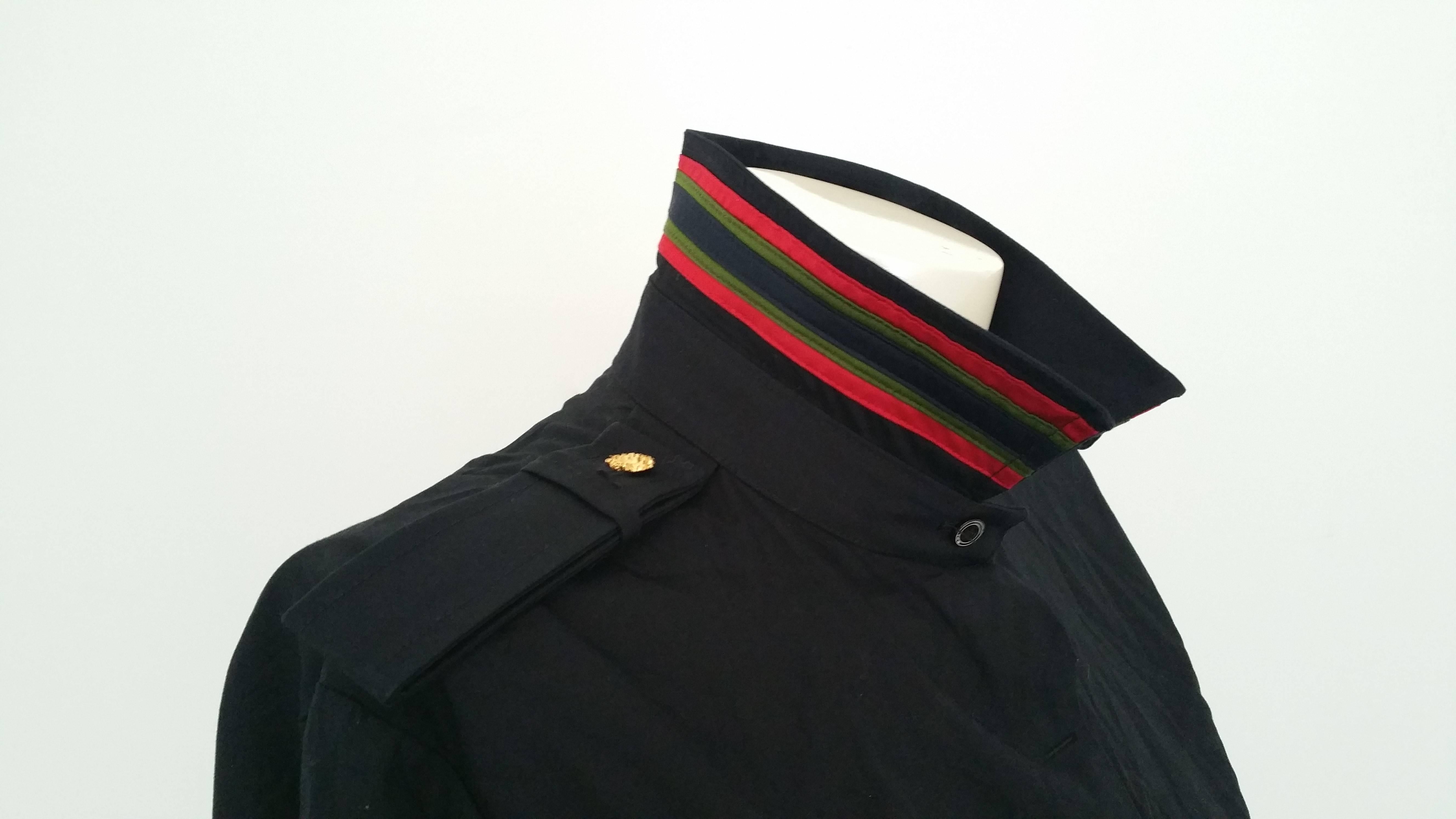 1970s Roberta Di camerino dark blu shirt still with tags

Military straps on both shoulder red and green collar 

Totally made in italy

Size:  44 italian size range