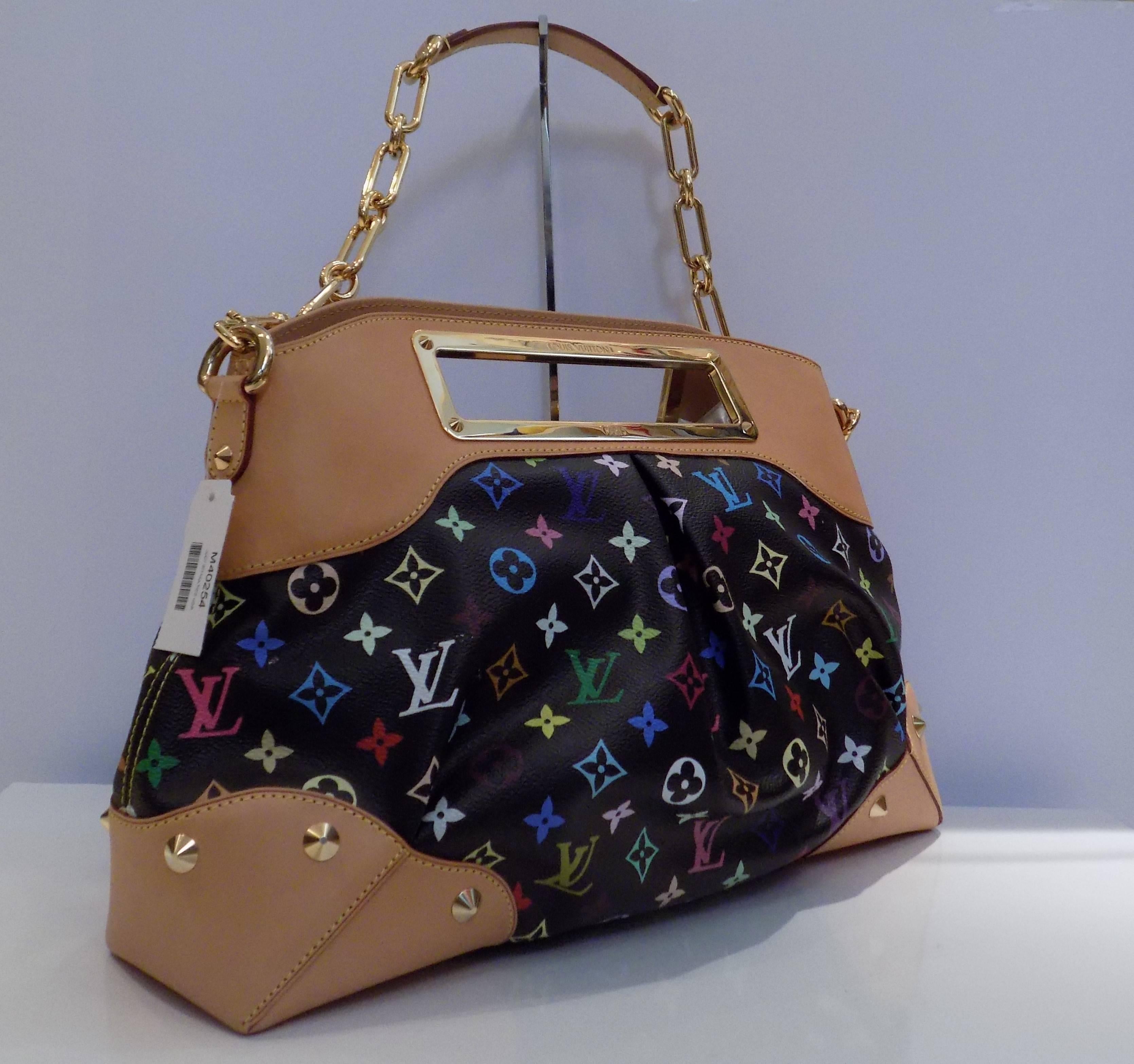 This Louis Vuitton Murakami Judy PM Chain Shoulder Bag is in great condition!  With its' colorful canvas exterior, this shoulder bag is perfect for any outfit, any occasion! The canvas exterior shows no signs of wear, tear, or stains. still with the