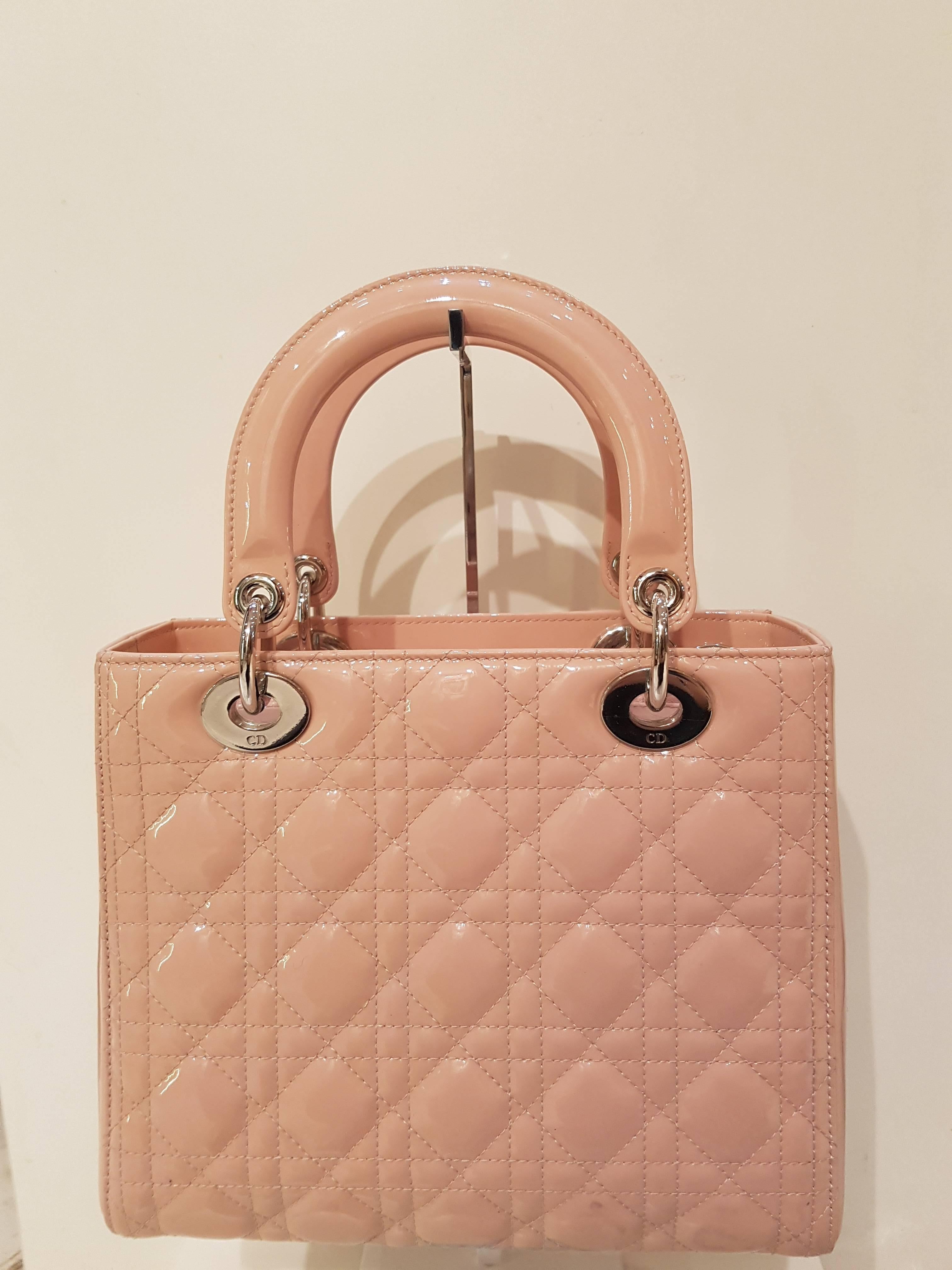 A timeless and unique work of art, the ‘Lady Dior’ bag is imbued with the Couture spirit of Dior. Meticulously crafted by hand, this baby pink lambskin bag is enhanced by iconic Dior ‘Cannage’ stitching. It is to be carried by hand or on the