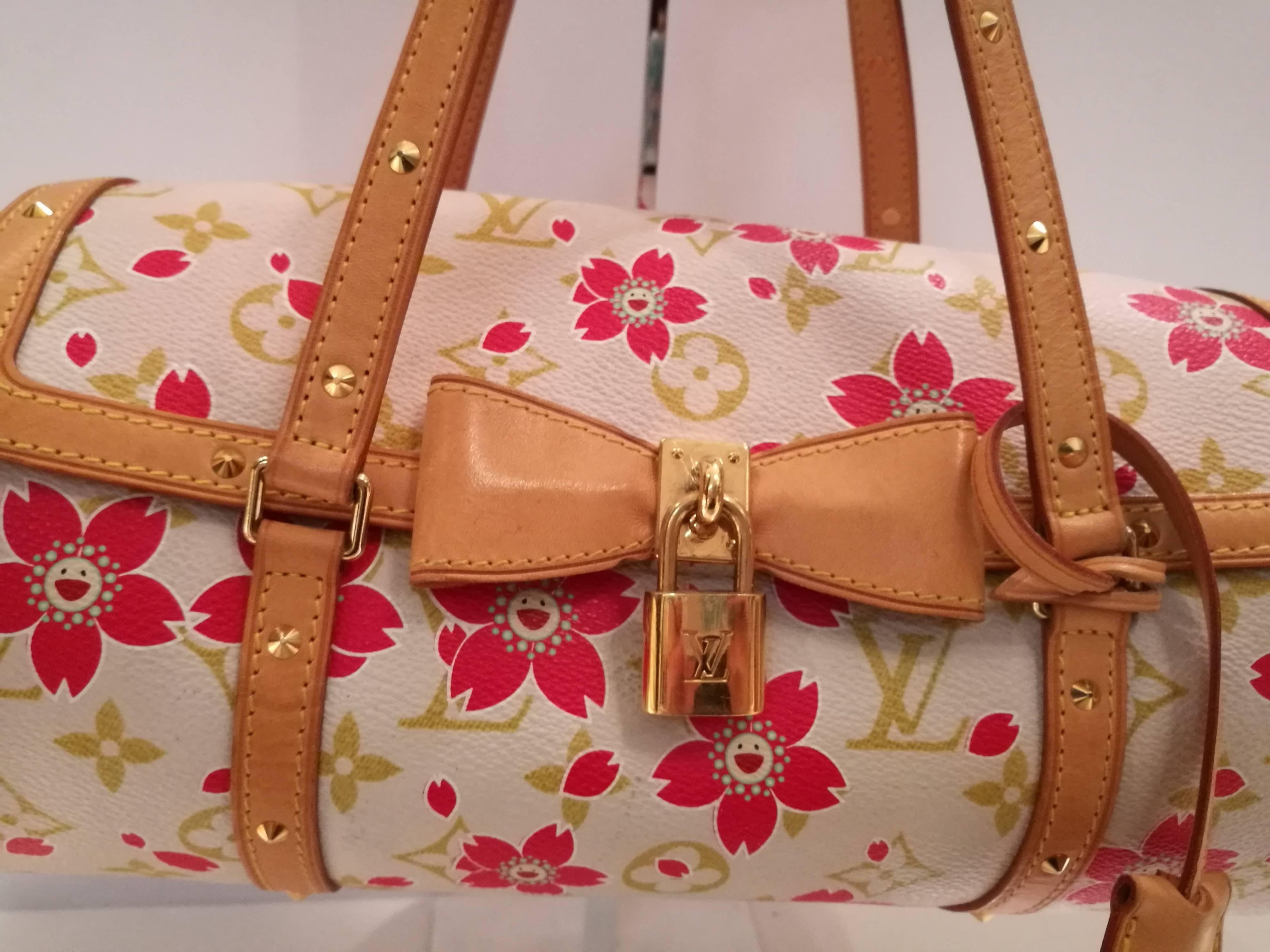 Louis Vuitton’s Limited Edition Cherry Blossom Papillon is a fabulous find in near excelletn condition.  Designed in conjunction with artist Takashi Murakami, this is a highly collectible style that is no longer in production. 

Light pink durable