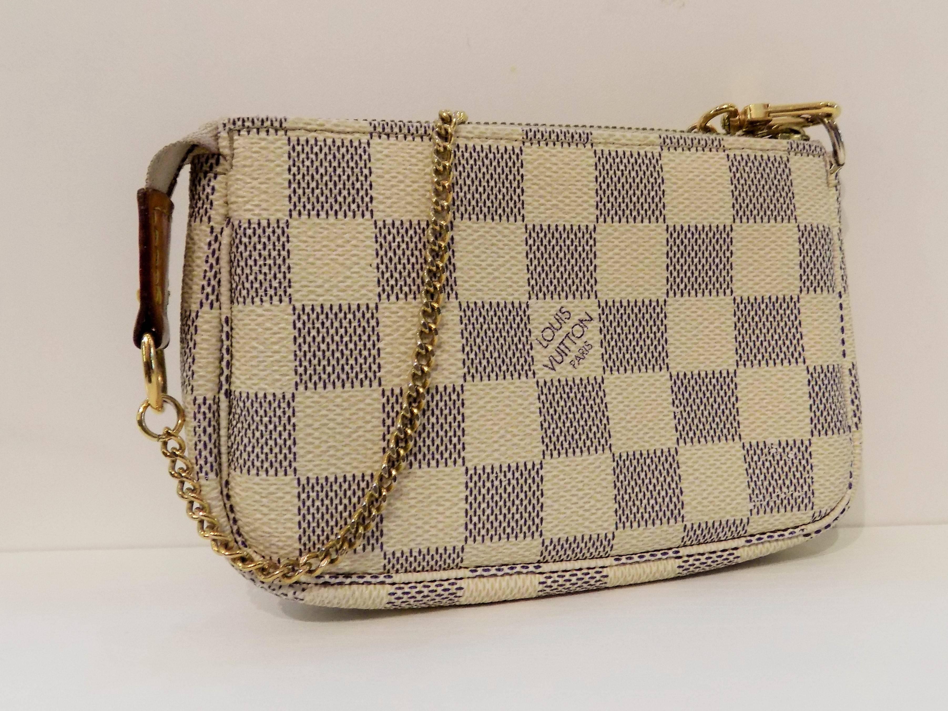 Louis Vuitton Damier Azur Pochette
Whether it is clipped to another bag or carried independently, the Mini Pochette Accessoires in striking Damier canvas is a playful addition to any wardrobe.

