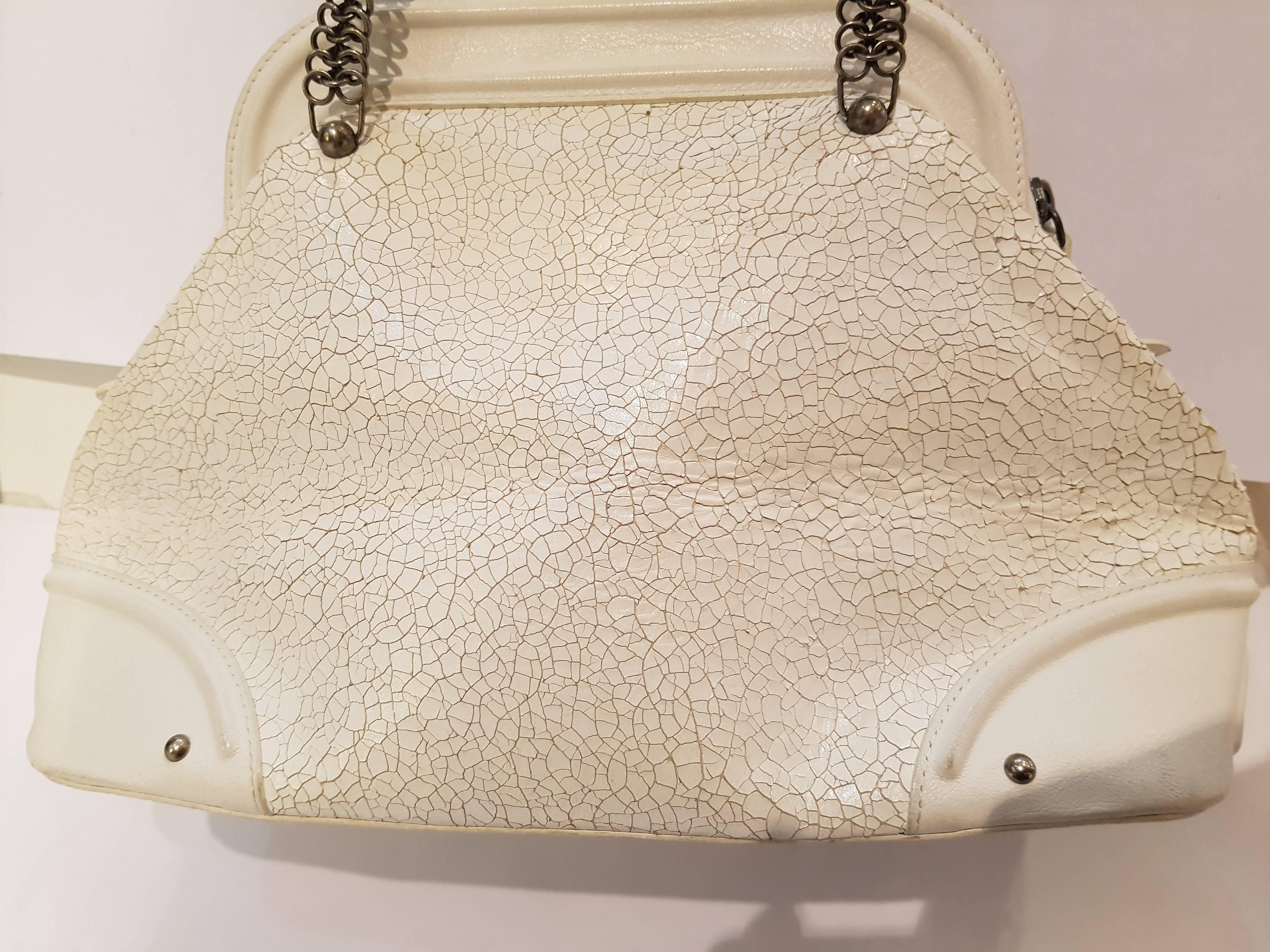 Christian Dior Nubuck Medium Jeanne Frame Bag 
This chic tote is beautifully crafted of chartreuse canvas. The bag features chartreuse leather trim and top handles of chain mail with leather grips as well as an oversized chain mail frontal belt.