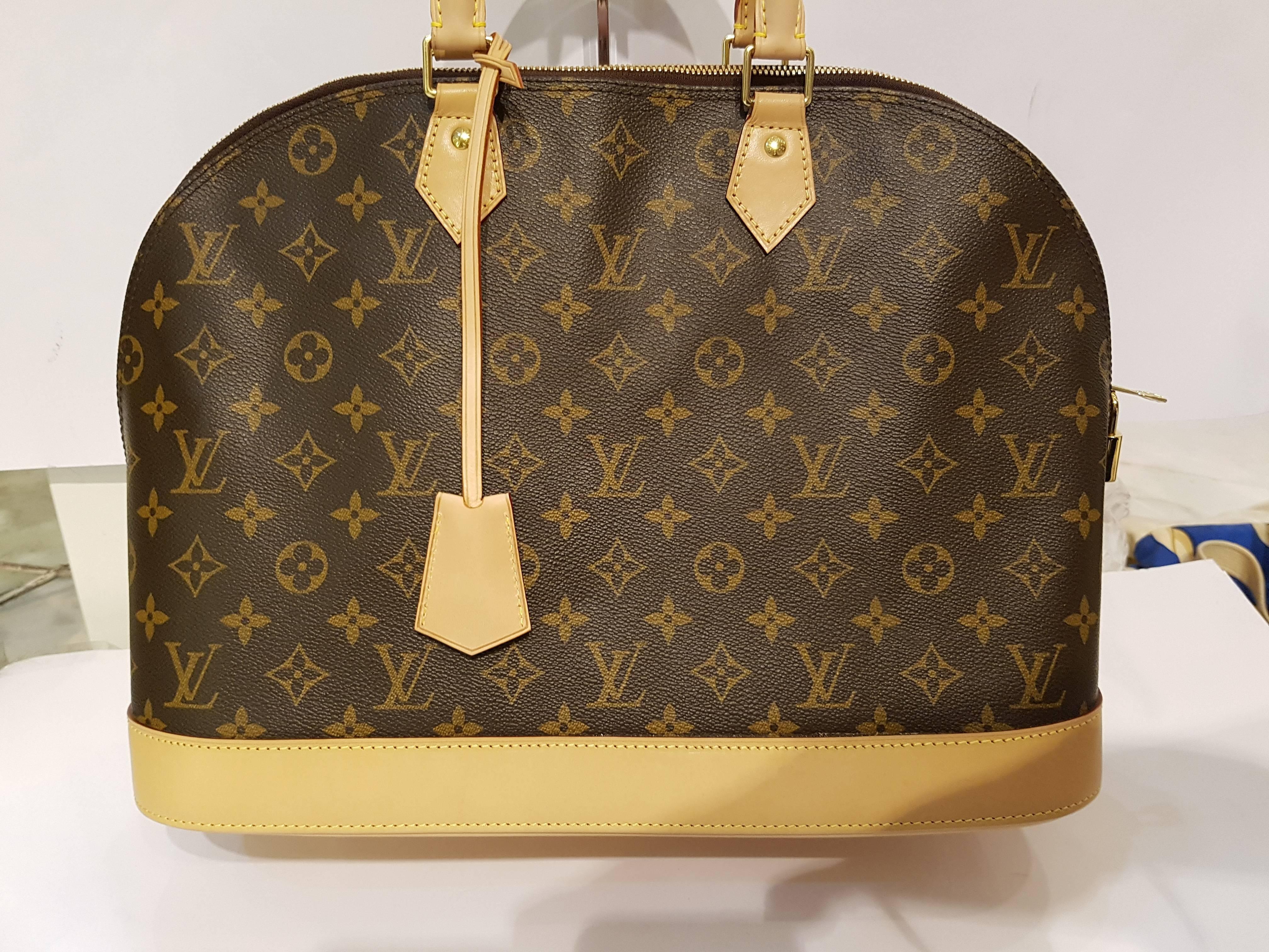 The most structured of the iconic Louis Vuitton handbags. The original was the creation of Gaston Vuitton, who named it for the Alma Bridge, a span that connects two fashionable Paris neighborhoods. Shown here in signature Monogram canvas