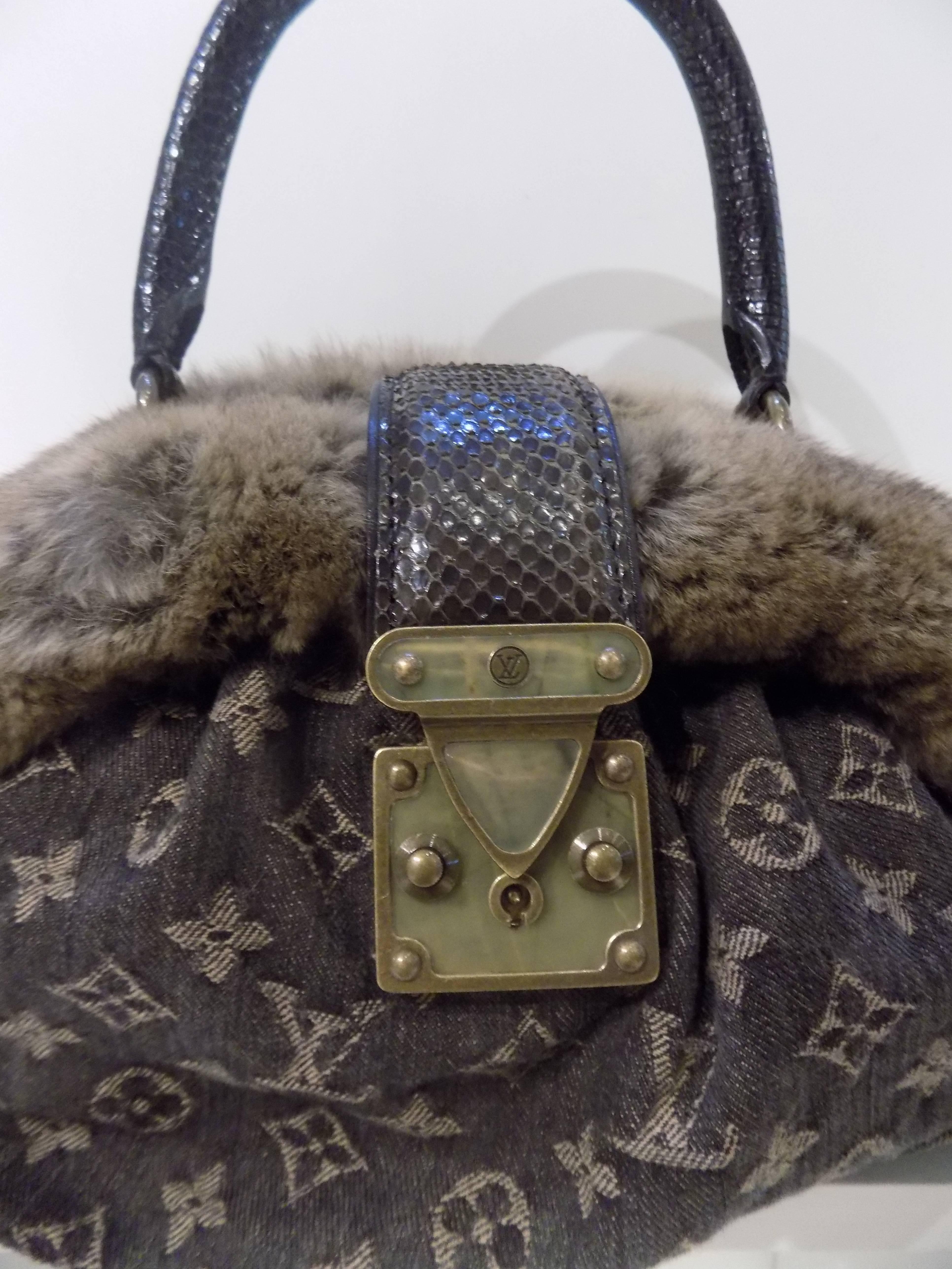  LOUIS VUITTON Monogram Denim Chinchilla Demi Lune 
This elegant tote is a creation of Louis Vuitton tonal monogram on brown denim with soft chinchilla and lizard. The bag features rolled lizard top handles, and a plush top rim of decadently soft