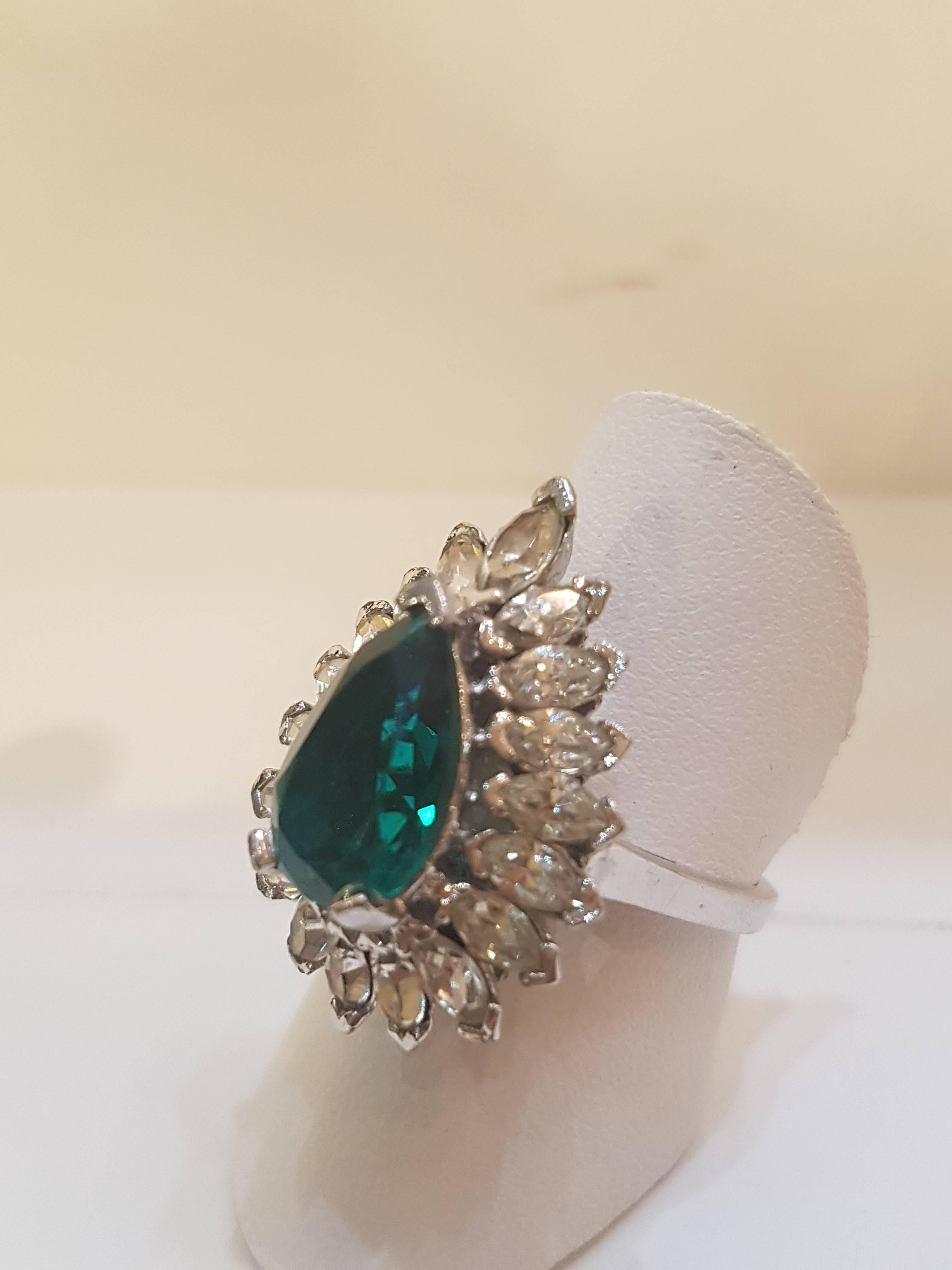 1980s Panetta silver tone ring
huge green tone stone with crystal all around
italian size range 13