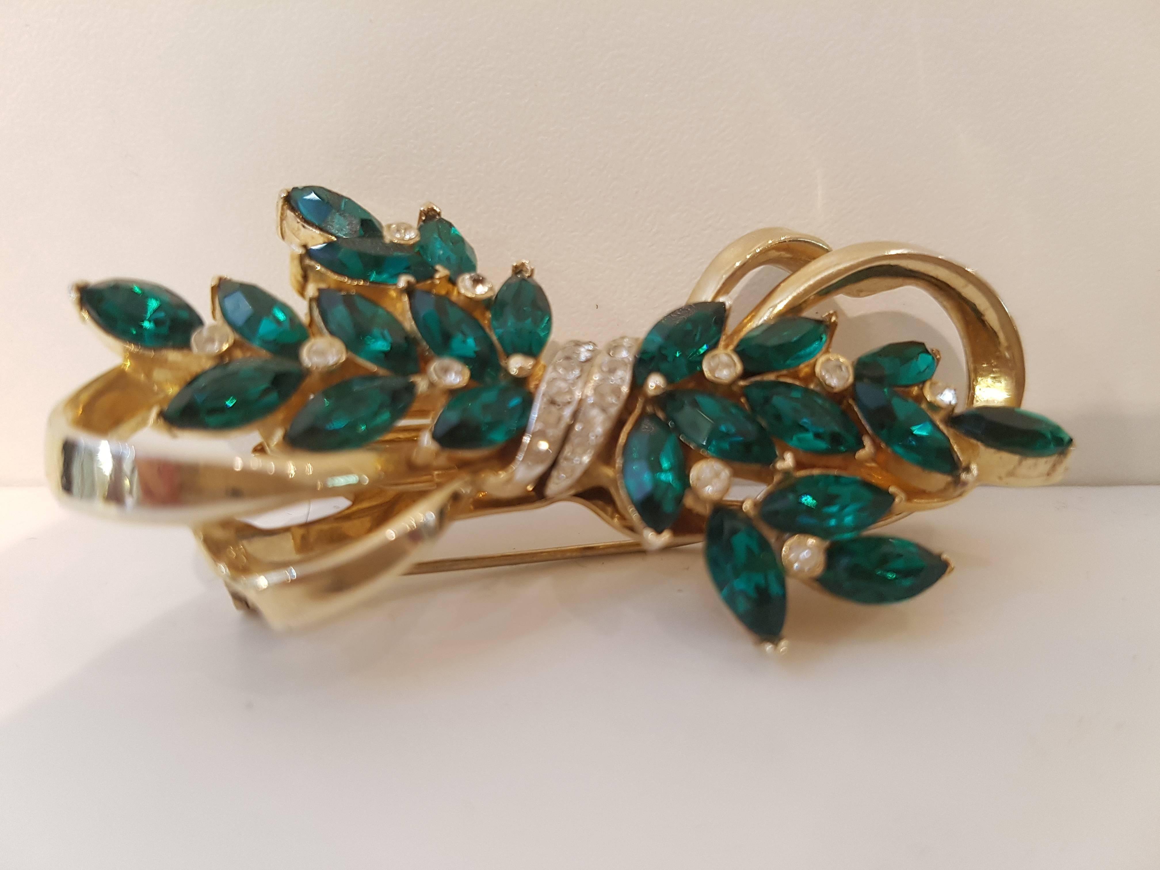 1980s Corocraft Vintage Brooch

Gold tone with green and crystal tone stones
