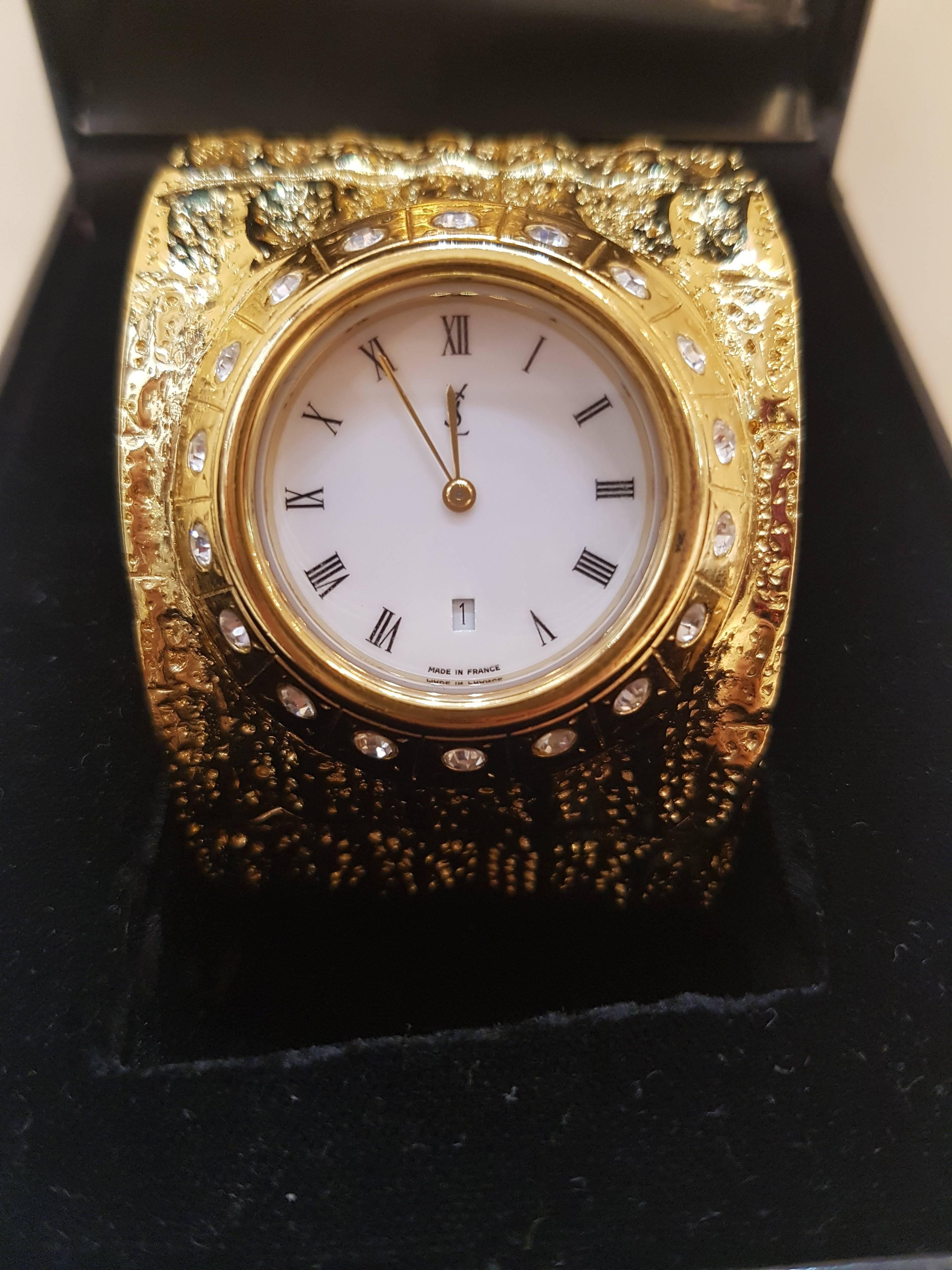 1990s Yves Saint Laurent Collection gold tone watch
Gold tone crystal stones 