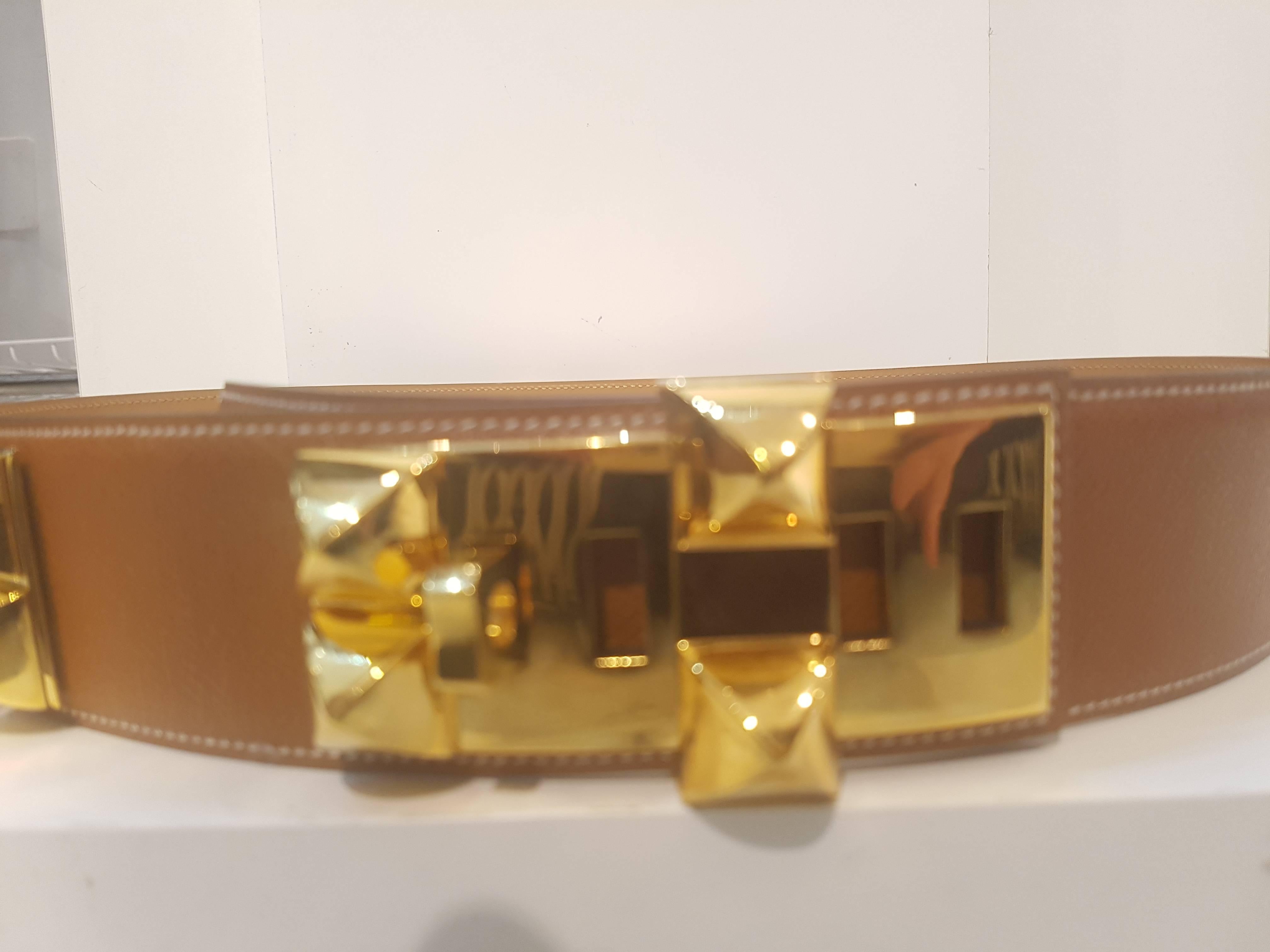 Popular vintage Hermes Collier De Chien Belt is up for sale. Inspired by a dog collar this is one of the most wanted Hermes belt. Pyramid studs are Hermes signature motif. Sold out everywhere. Plated gold hardware 
Still with box is in perfect