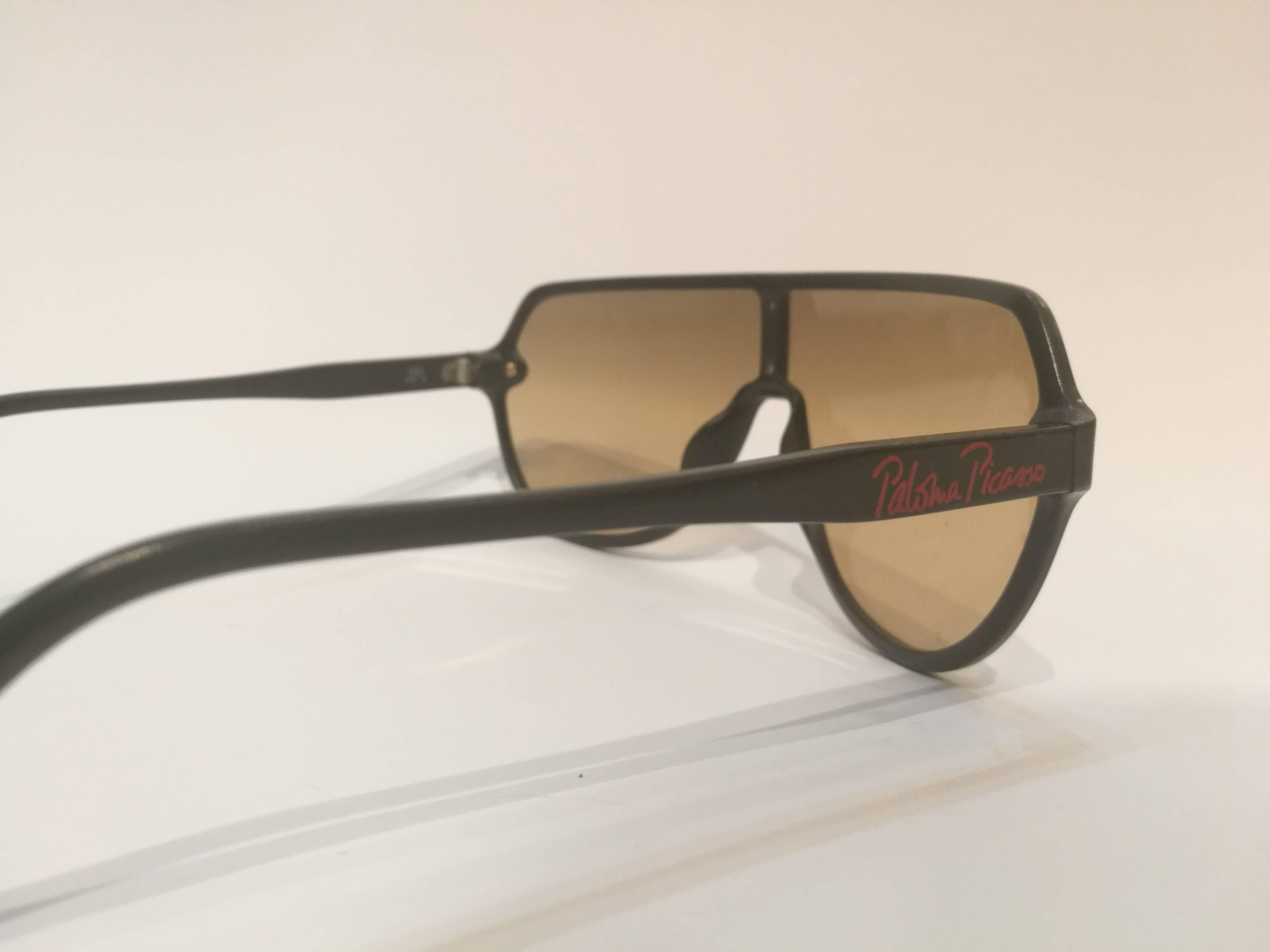 Brown Paloma Picasso black sunglasses