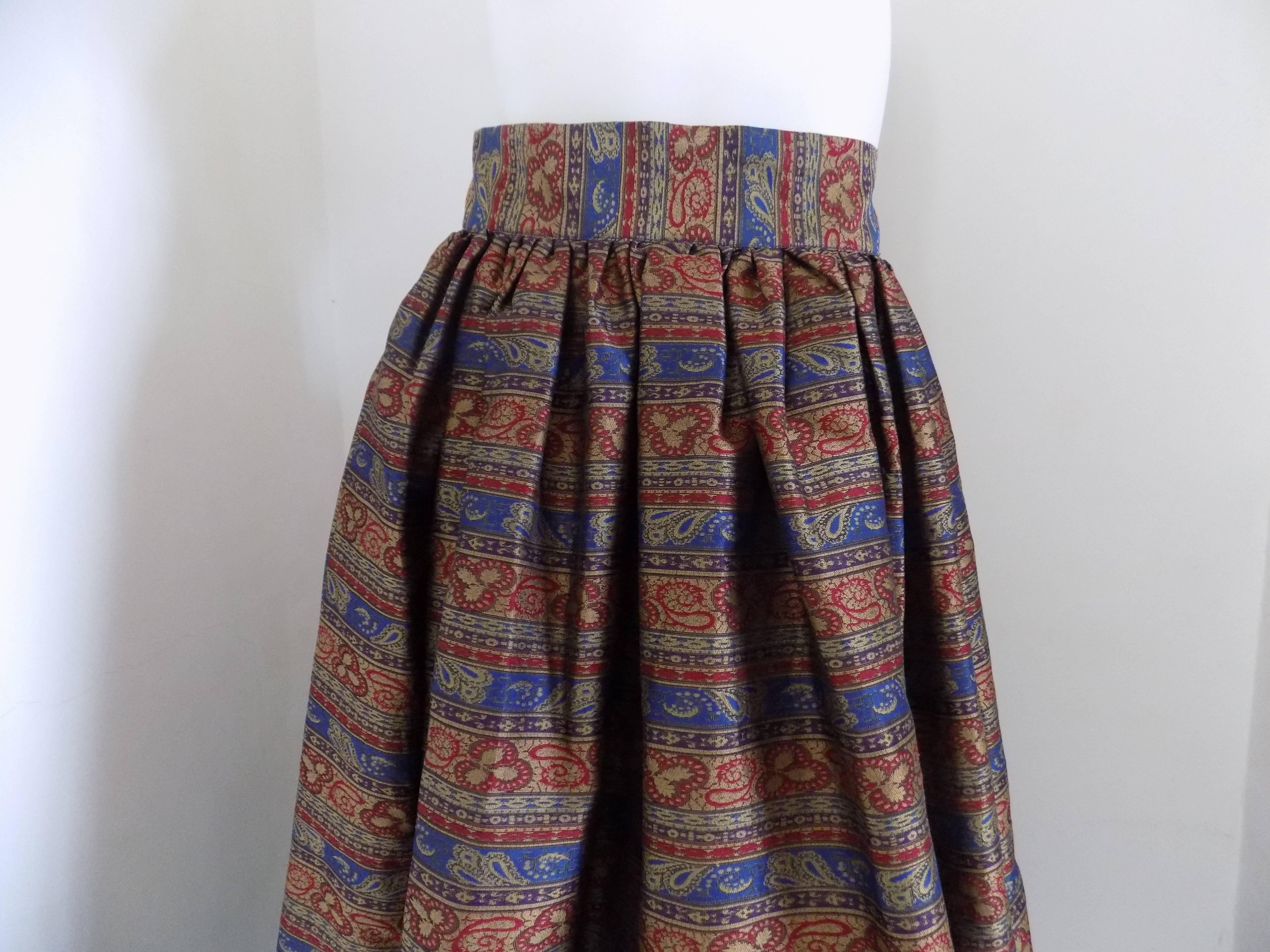 Quid multicolored long skirt
totall made in ital in italian size range M 
Blu red and gold high waist skirt