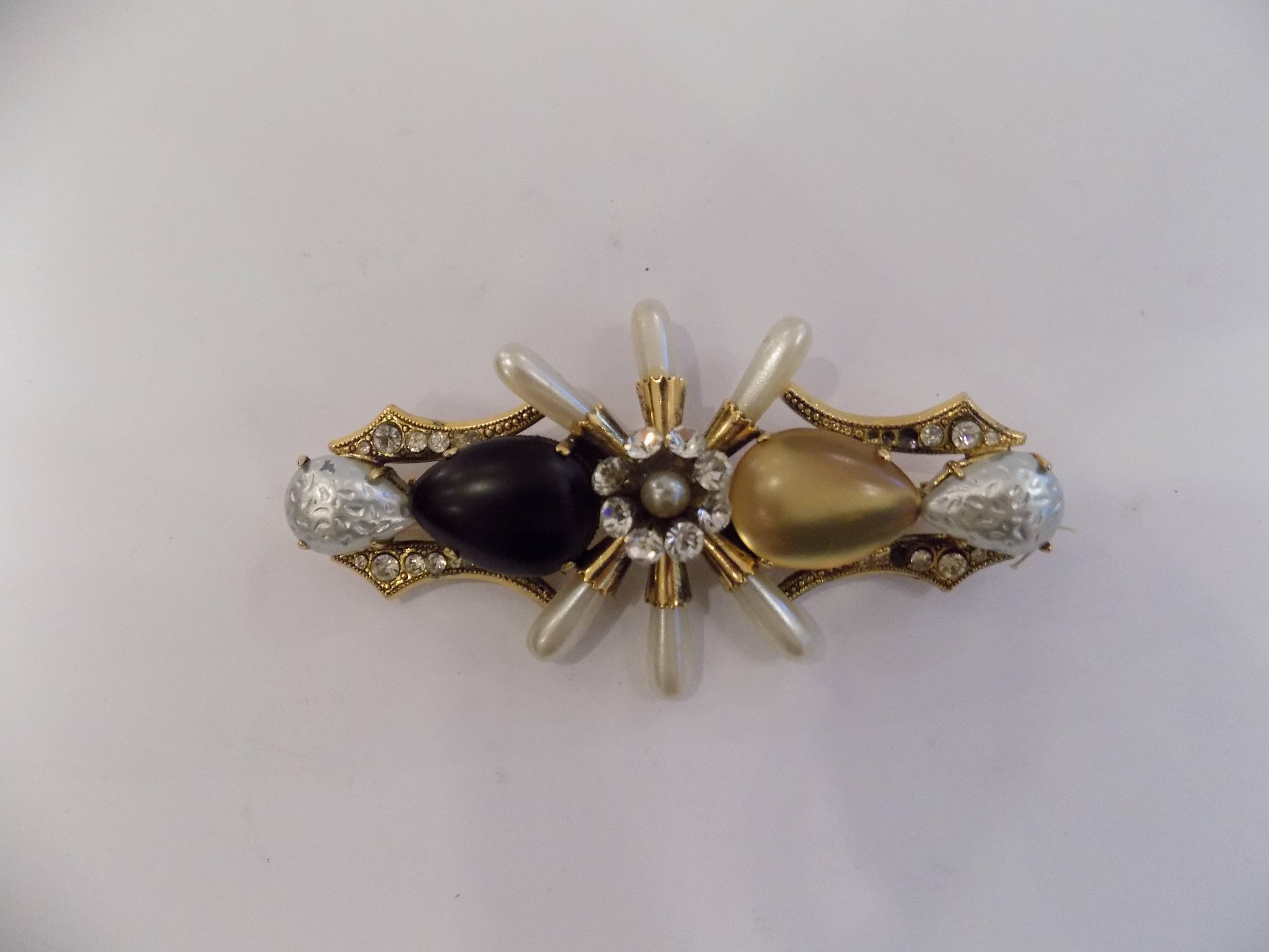Vintage Pin Brooch Gold tone with Gold, black and crystal stones on it