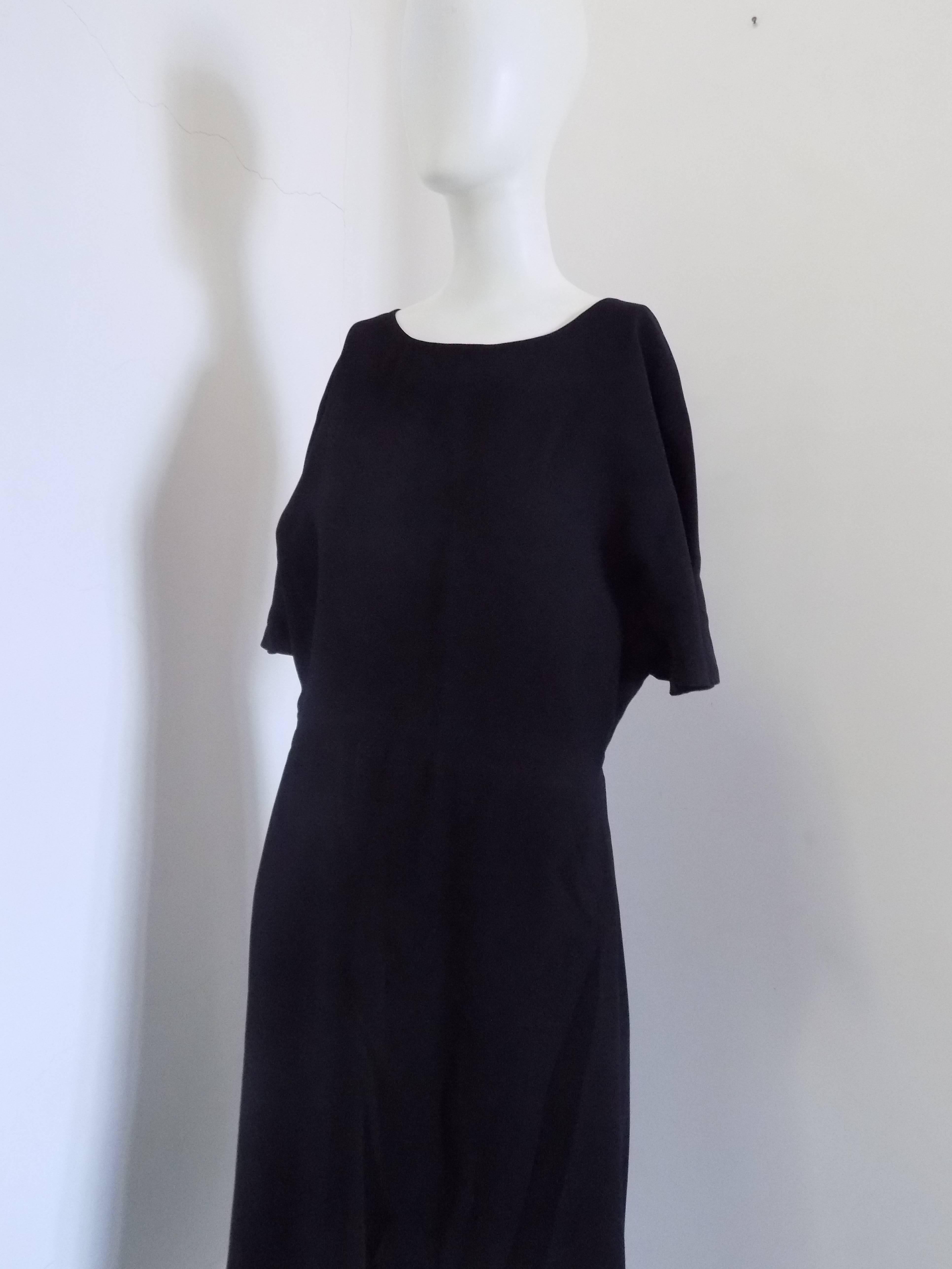 1990s Valentino Black Dress

Totally made in italy in italian size range 44

Composition: Viscose and elastane